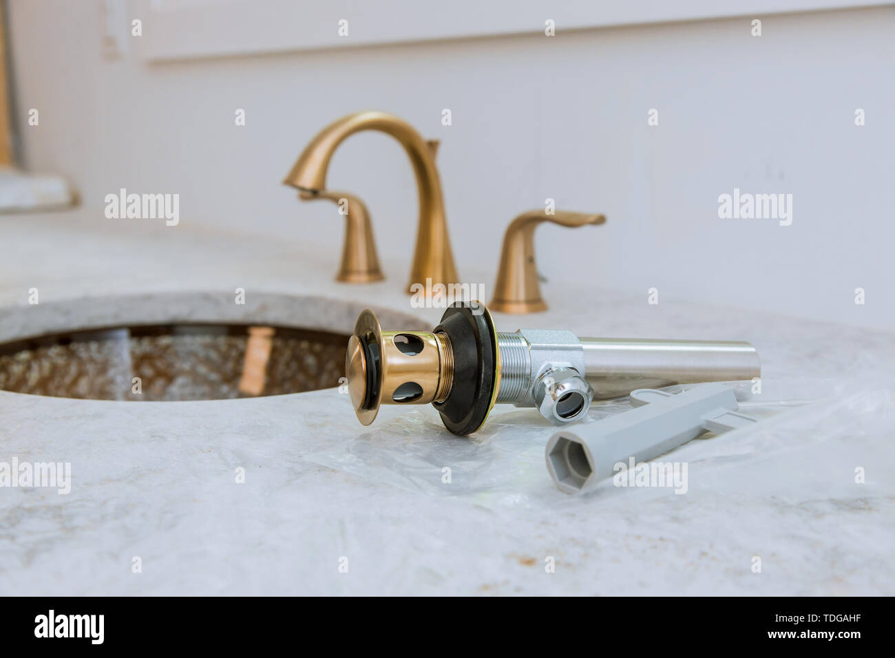 Plumbing repair service drain assemble and install bathroom sink Stock Photo Alamy