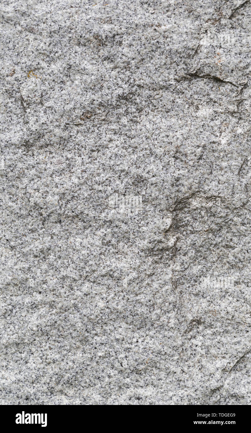 Close-up of white, fine-grained granite surface. High resolution full frame texture background. Stock Photo
