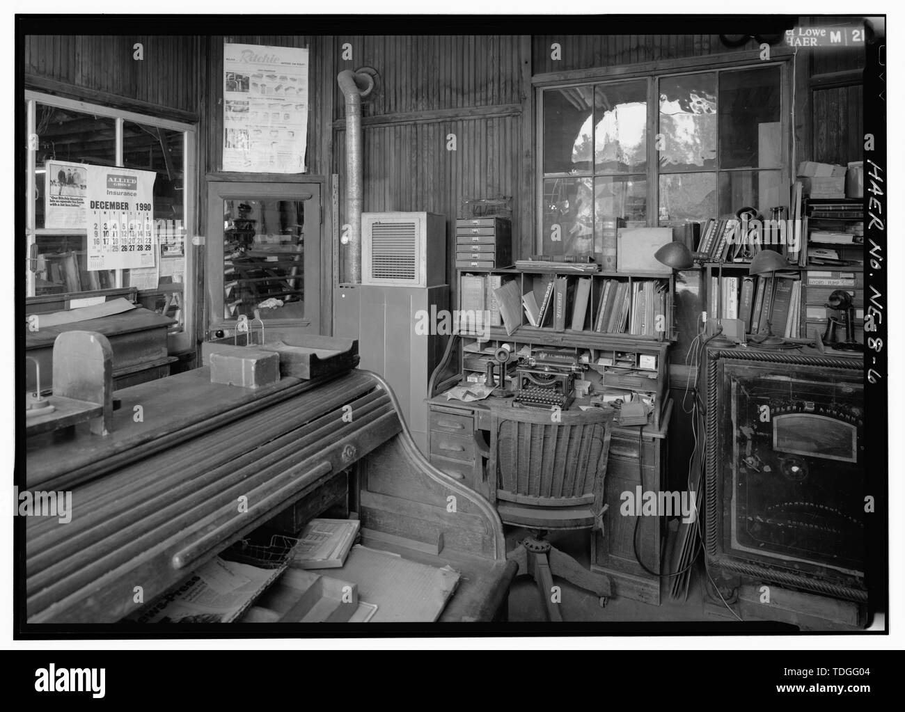 NORTHWEST ACROSS INTERIOR OF OFFICE IN SOUTHEAST CORNER OF BUILDING TOWARD SHOP DOOR, SHOWING TWO DESKS, SAFE, AND OFFICE FIXTURES-BUSINESS MACHINES. - Kregel Windmill Company Factory, 1416 Central Avenue, Nebraska City, Otoe County, NE Stock Photo