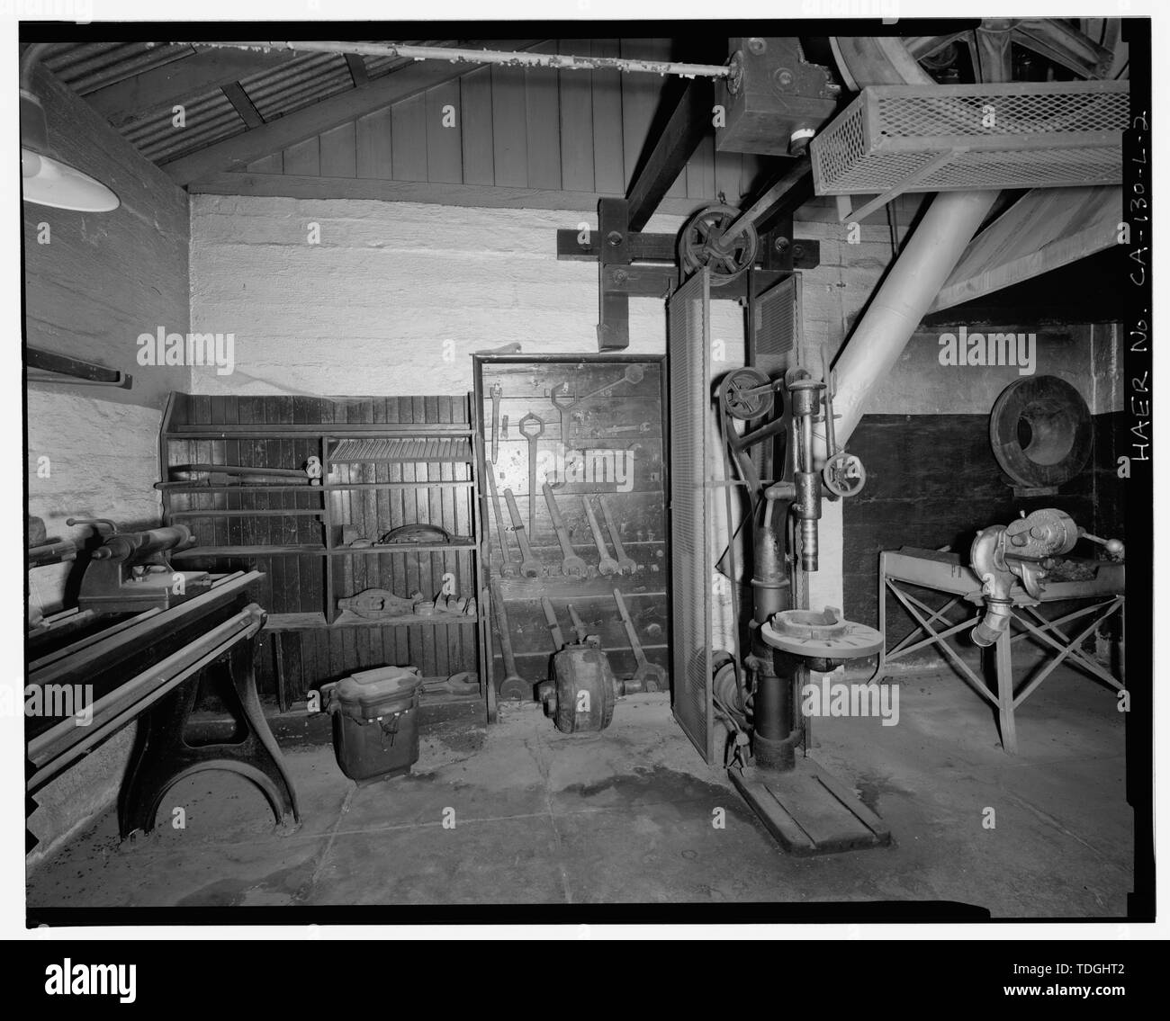 NORTHWEST WALL OF INTERIOR, SHOWING TOOL BOARD AND DRILL PRESS. VIEW TO NORTHWEST. - Santa Ana River Hydroelectric System, SAR-1 Machine Shop, Redlands, San Bernardino County, CA Stock Photo