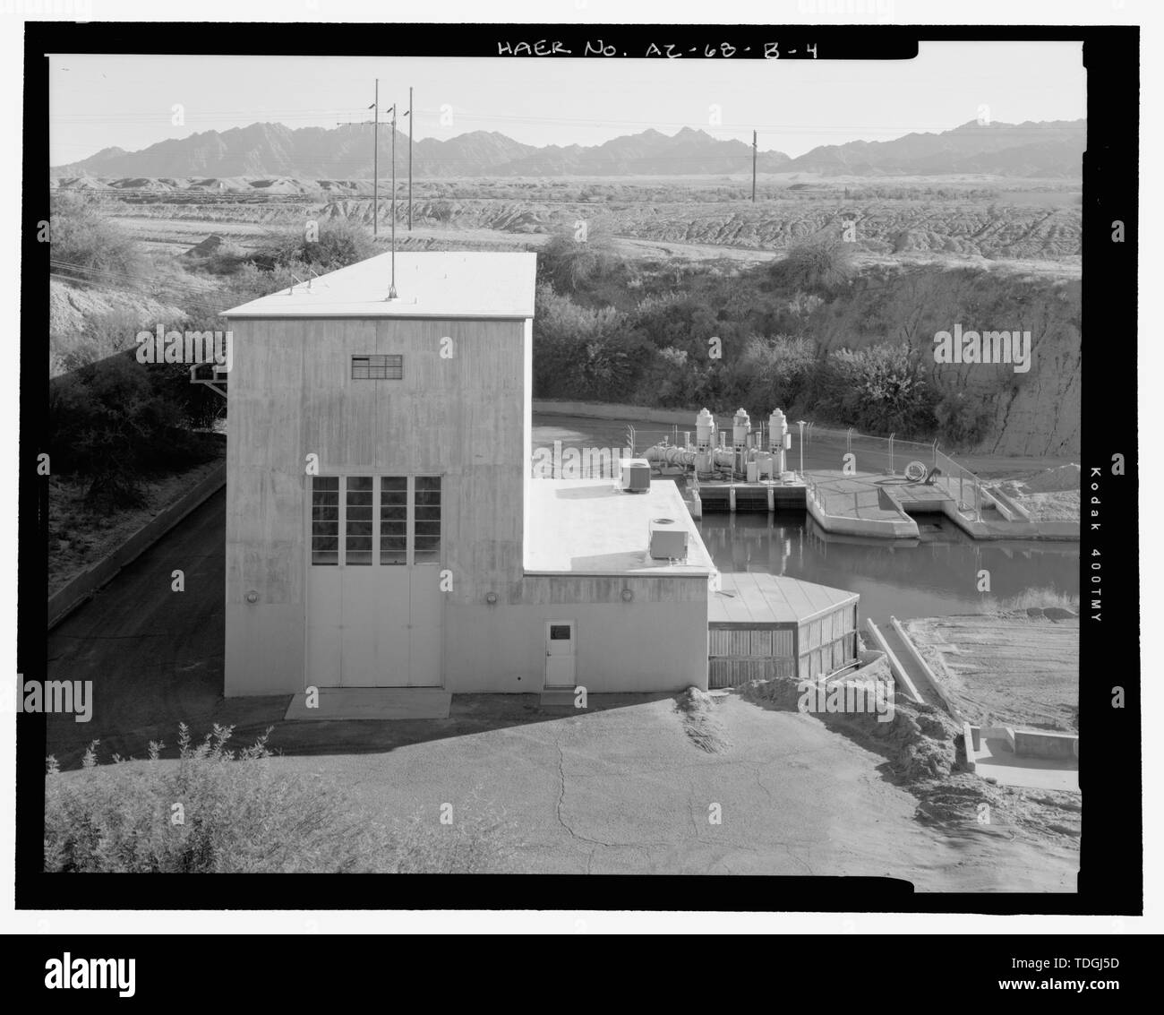 North side, showing folding double doors, main control room wing, and modern roof construction - Wellton-Mohawk Irrigation System, Pumping Plant No. 2, Bounded by Interstate 8 to south, Wellton, Yuma County, AZ Stock Photo