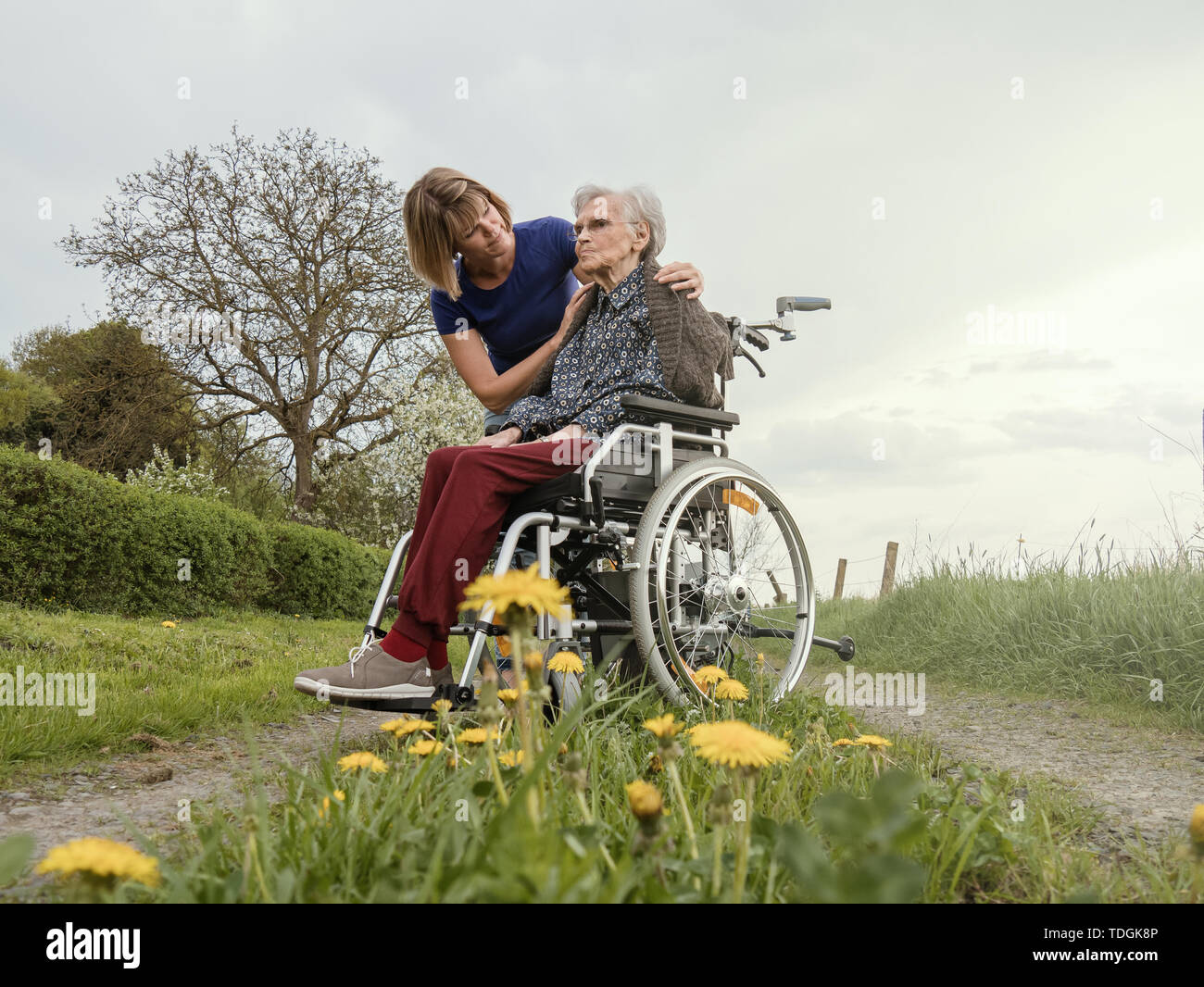 Sad old woman in wheelchair hi-res stock photography and images - Alamy