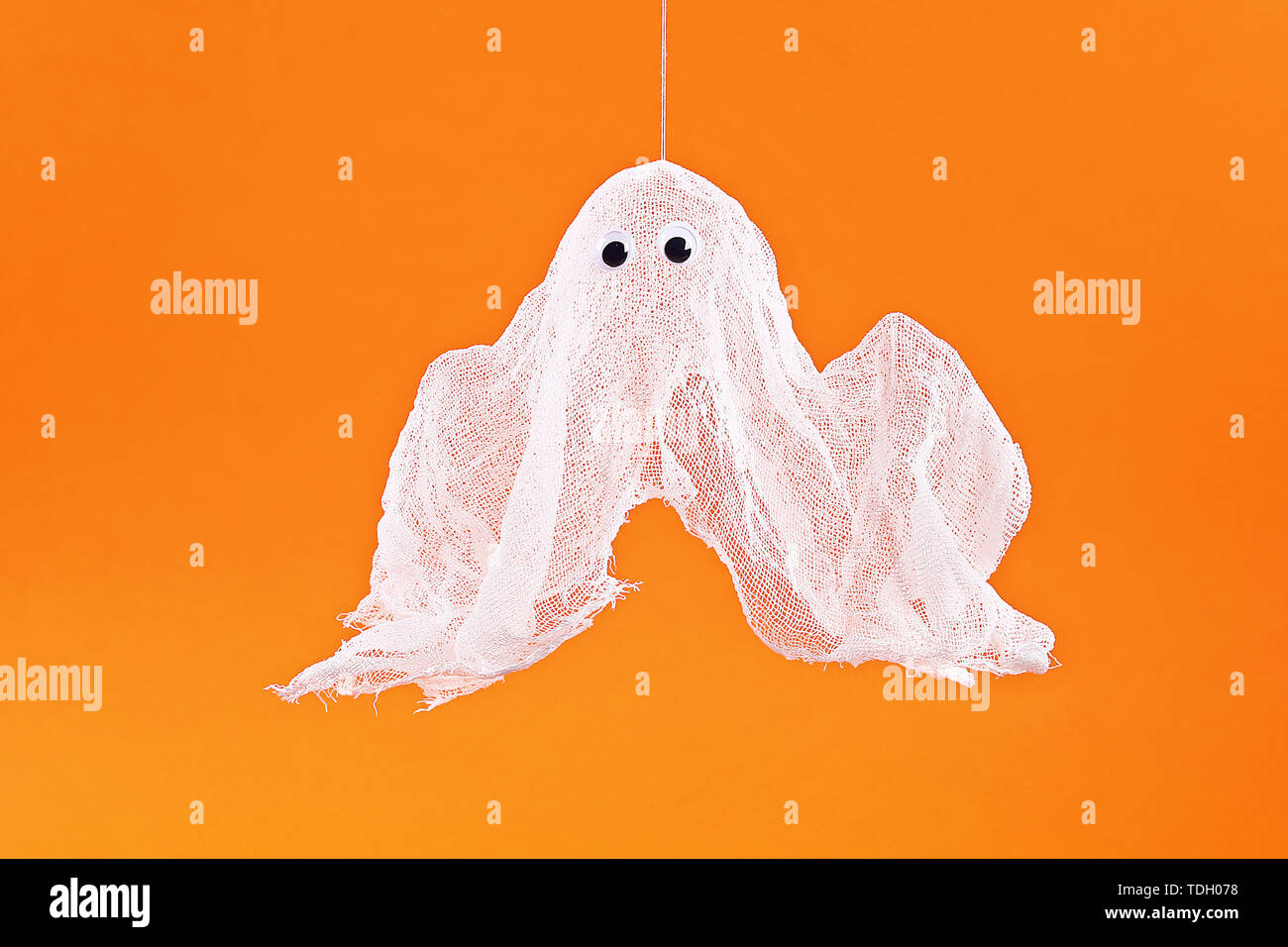 15 Diy Halloween Ghost Of Starch And Gauze On Orange Background