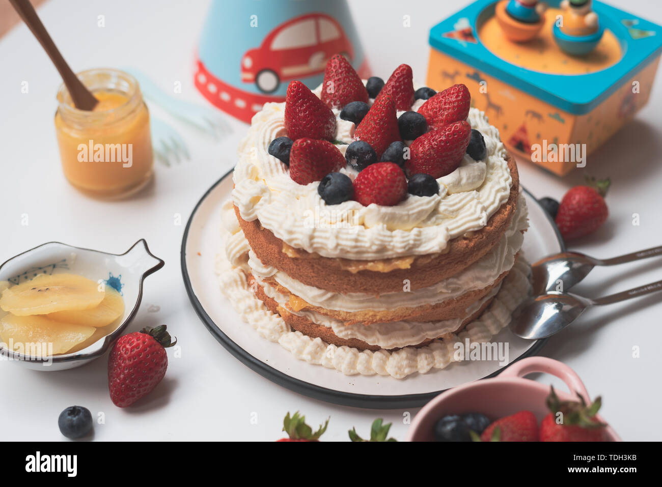 Strawberry birthday cake Stock Photo - Alamy