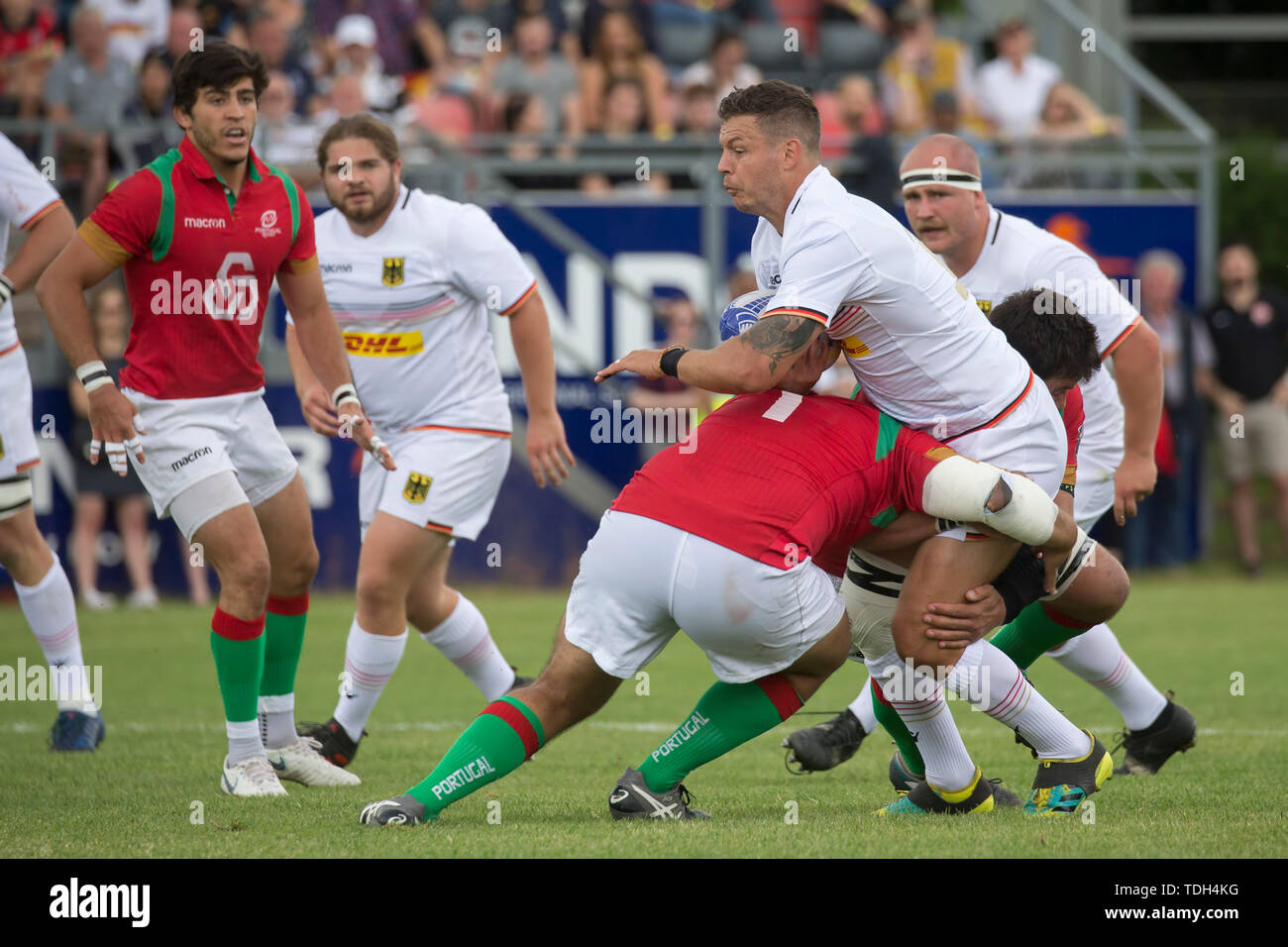 Hessen, Germany. 15th June, 2019. Rugby: EM, Relegation, Germany - Portugal. Raynor Parkinson (Germany, 10) is stopped rudely by Joao Vasco Corte-Real (Portugal, 1). Credit: dpa picture alliance/Alamy Live News Stock Photo