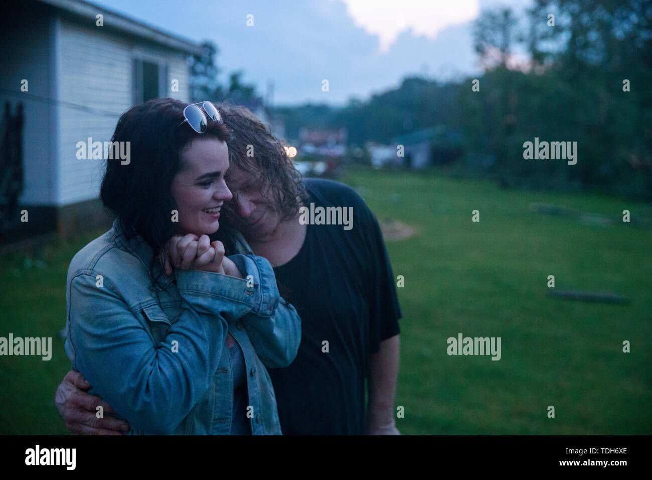 Ellettsville, USA. 15th June, 2019. Nicole Rood and her boyfriend Brett Cantrell hug after they survived a tornado in the 6400 block of West Cowden Rd. near Ellettsville. Brett Cantrell survived by hanging onto a tree, and Rood hung onto the handle of the front door of a house. The couple were in their car when the storm stuck. The tornado destroyed several homes, tore up trees, and left dangerous live power lines scattered around the area. Credit: SOPA Images Limited/Alamy Live News Stock Photo