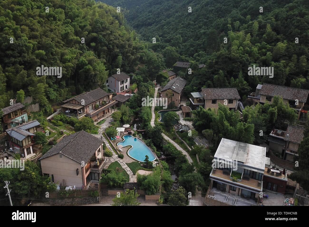 Tonglu. 16th June, 2019. Aerial photo taken on June 16, 2019 shows part of a rural tourism industrial cluster in Qinglongwu of Tonglu County, east China's Zhejiang Province. In recent years, Tonglu County has been rolling out measures to develope rural tourism industry. Qinglongwu was transformed into a base of rural guesthouses for tourists to experience the countryside life. Credit: Huang Zongzhi/Xinhua/Alamy Live News Stock Photo
