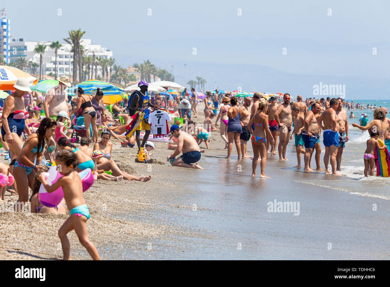 Costa Almeria, spanish tourism, busy beach in roquetas de mar, almeria, spain Stock Photo