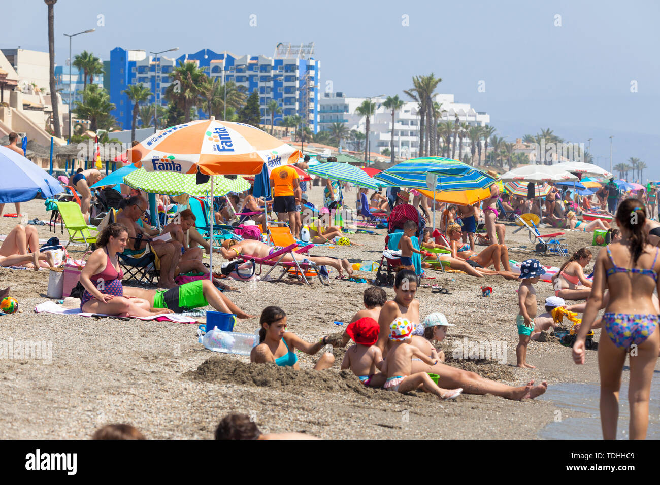 Costa Almeria, spanish tourism, heatwave in spain, busy crowded beach in roquetas de mar, almeria, spain Stock Photo