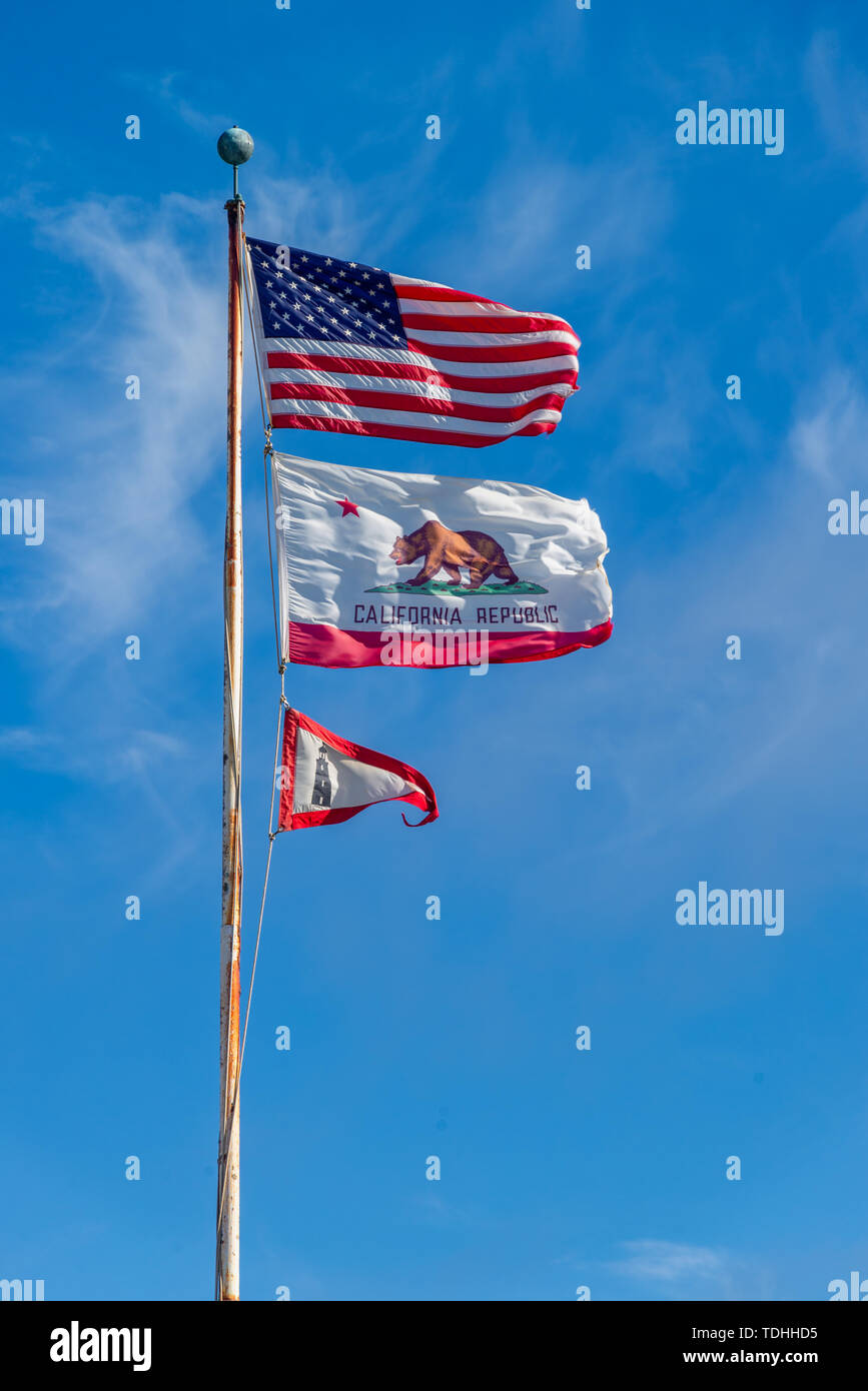 THe US Stars and Stripes, old glory and the California Republic flags waving Stock Photo