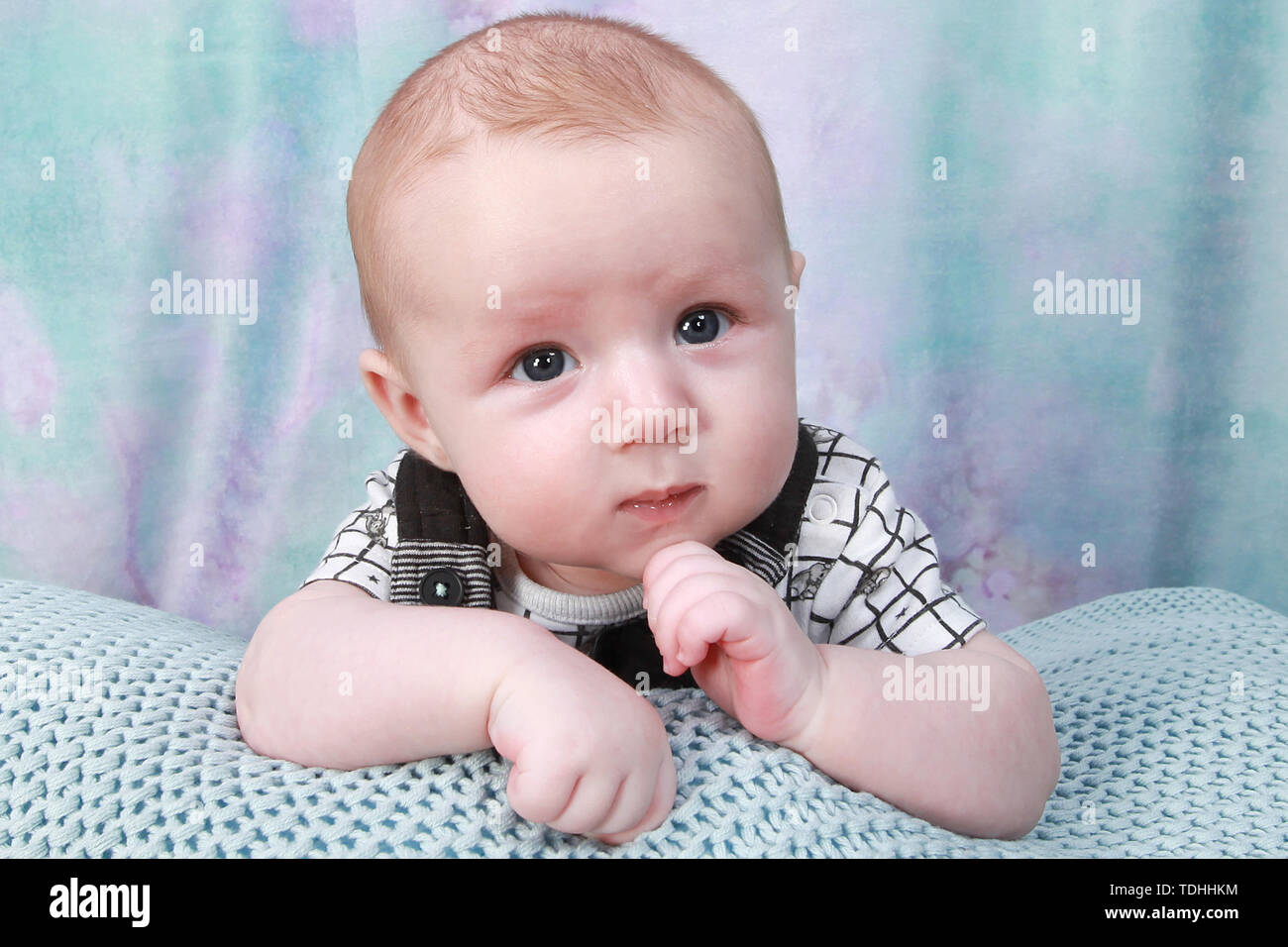 3 month old baby boy relaxing Stock Photo