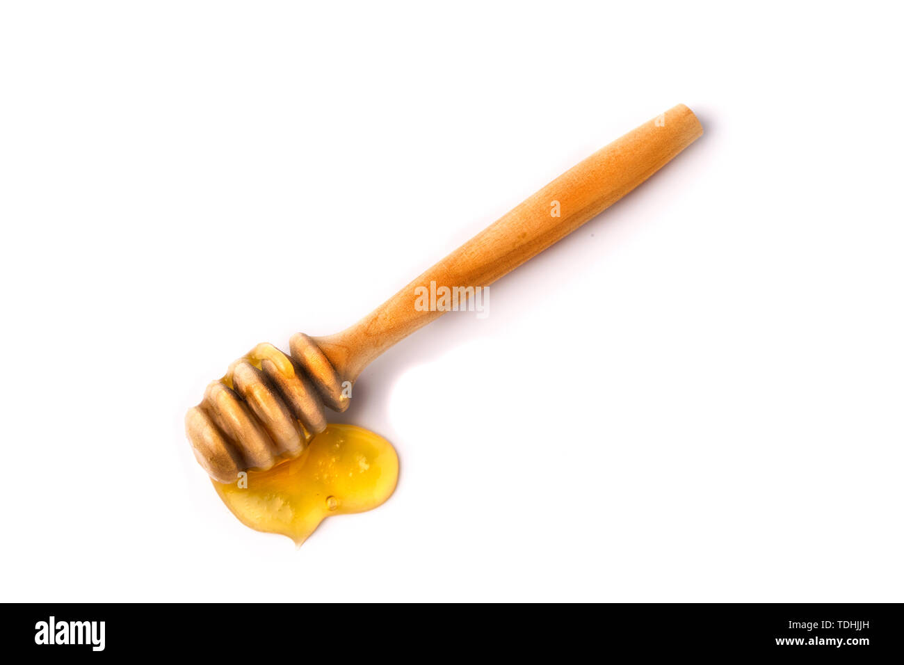 Honey stick with flowing honey isolated on white background Stock Photo
