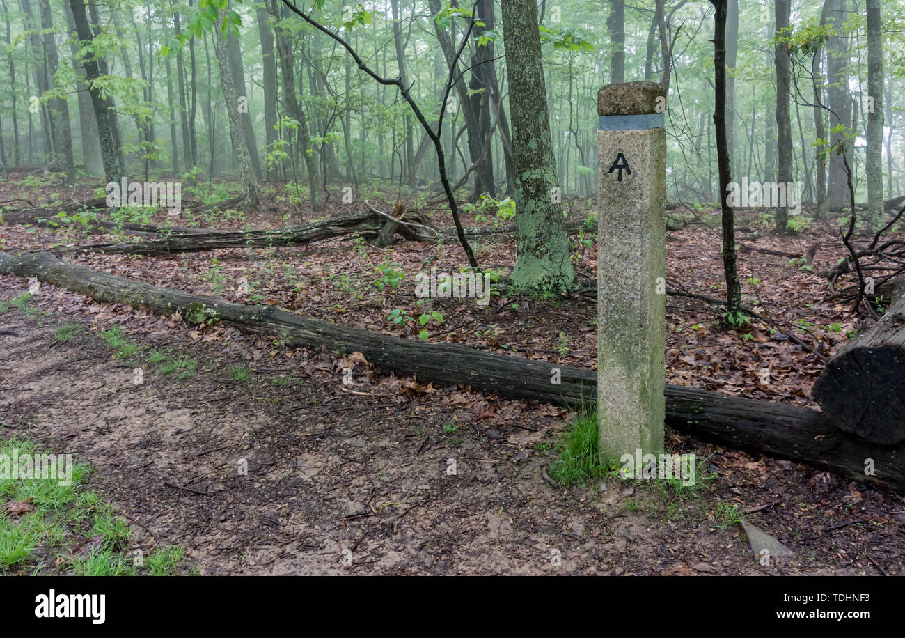 A post provides information for Appalachian Trail hikers near a road crossing Stock Photo