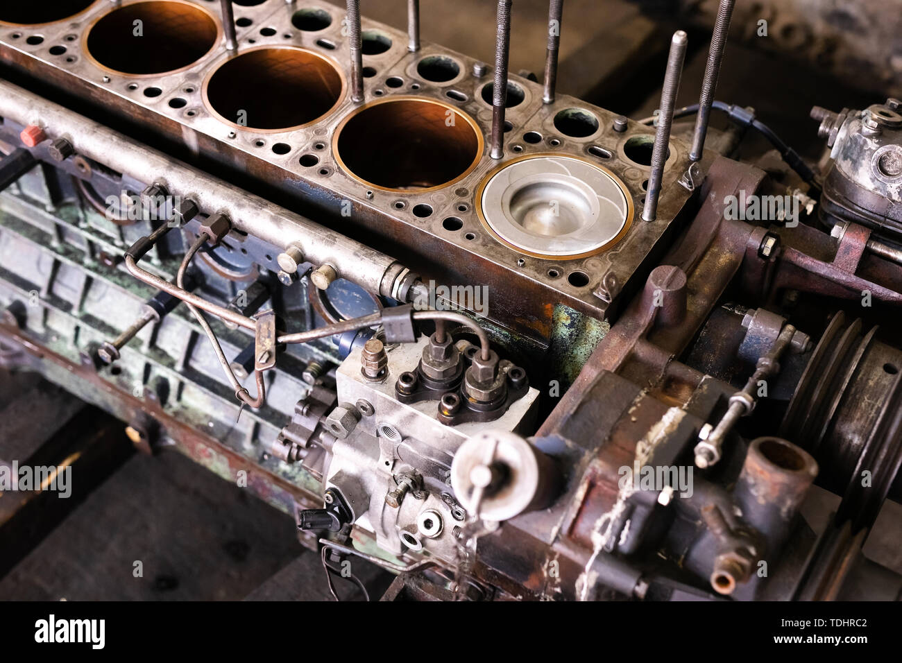 Engine parts of the old havy truck with rusty pipes. Tlorry motor
