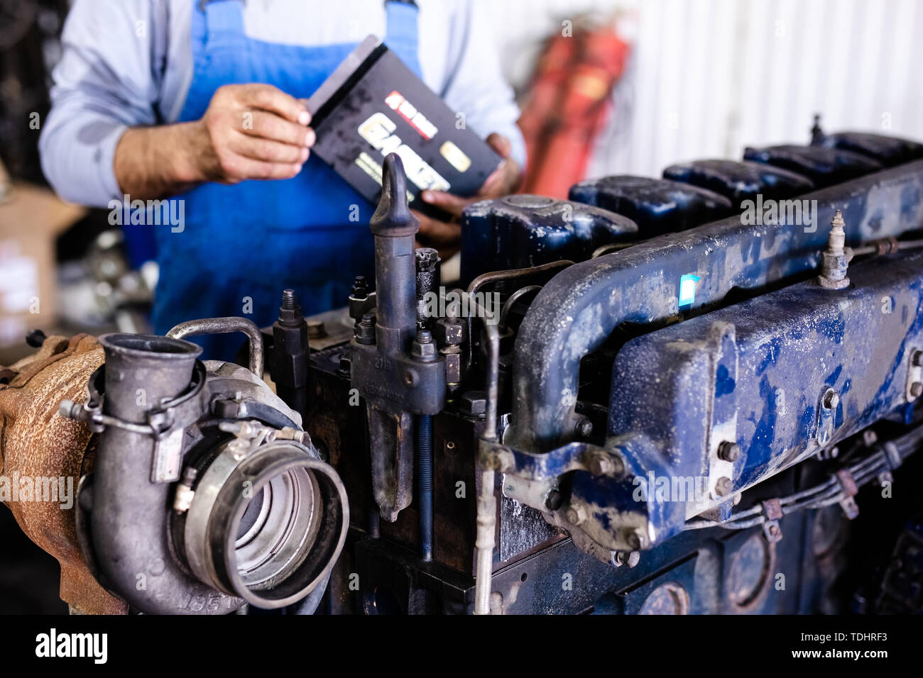 Mechanic opened the locking valve mechanism. Disassemble engine block ...