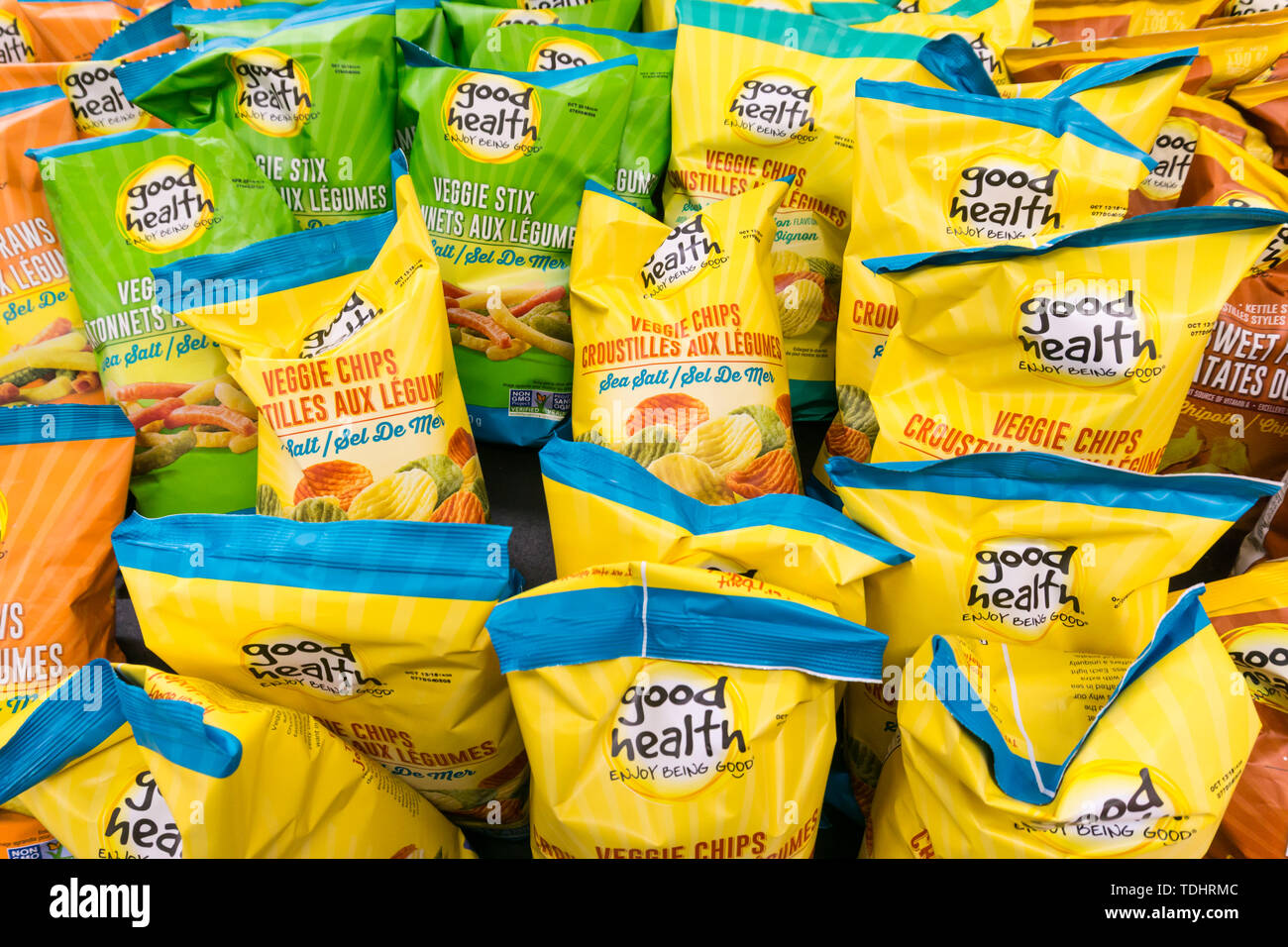 Packets of Good Health healthy potato crisps or potato chips for sale in a Canadian supermarket. Stock Photo