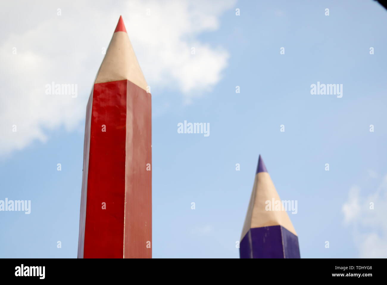 Blue sky pencil crayon building Stock Photo Alamy
