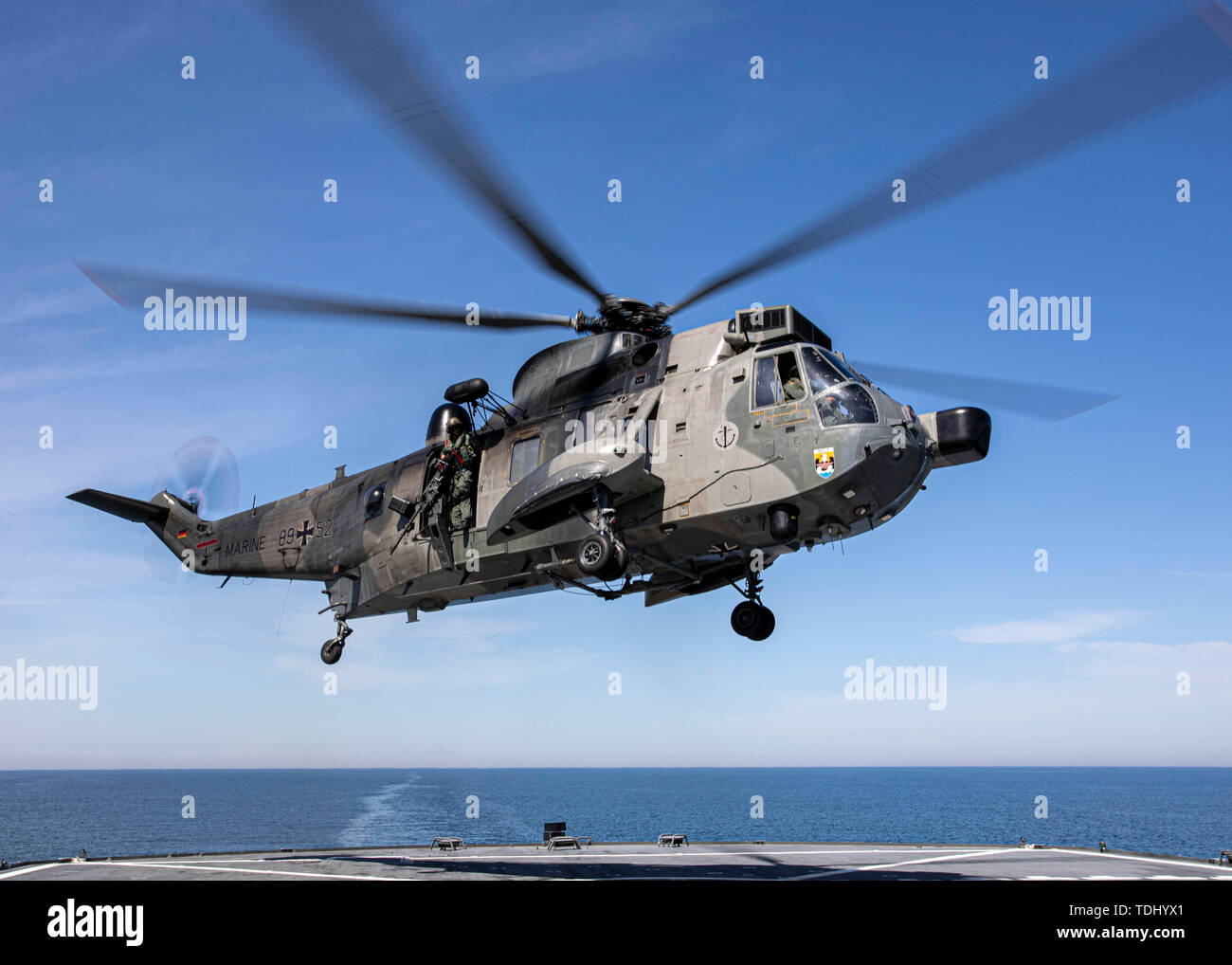 190615-N-EI510-0077 BALTIC SEA (June 15, 2019) A German Westland Sikorsy WS-61 Sea King search and rescue helicopter departs the Blue Ridge class command and control ship USS Mount Whitney (LCC 20) during exercise Baltic Operations (BALTOPS) 2019. BALTOPS is the premier annual maritime-focused exercise in the Baltic Region, marking the 47th year of one of the largest exercises in Northern Europe enhancing flexibility and interoperability among allied and partnered nations.  (U.S. Navy Photo by Mass Communication Specialist 2nd Class Scott Barnes) Stock Photo