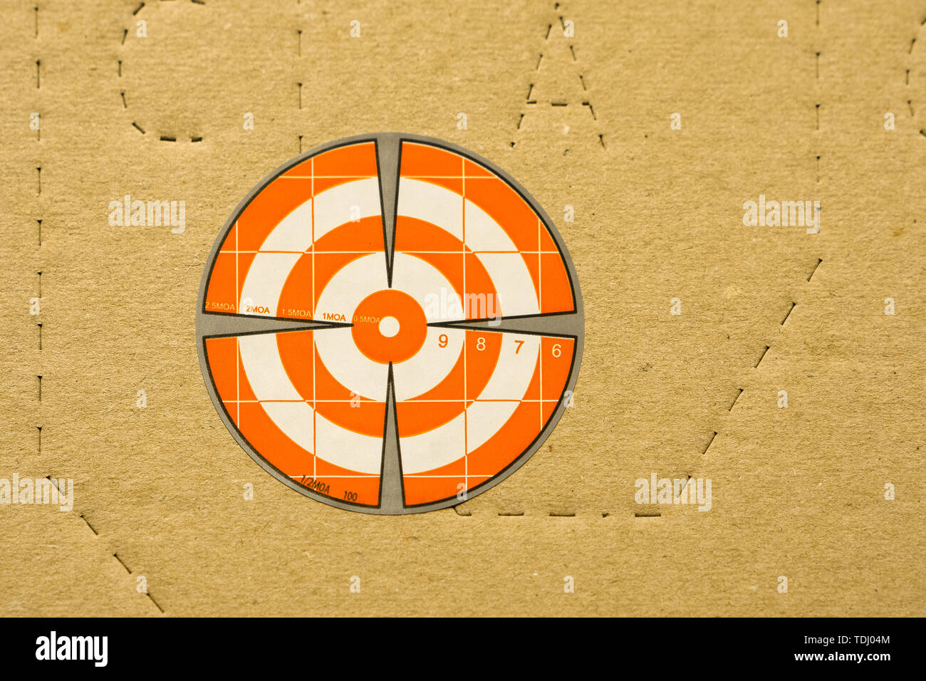 Paper orange target for shooting on IDPA target background Stock Photo