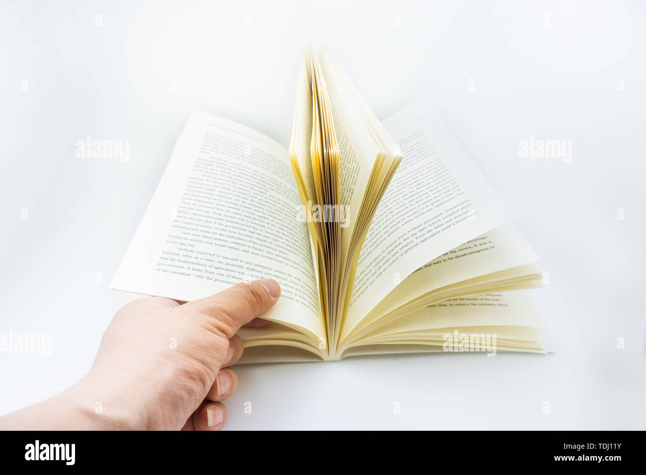 Books unfolding on white background Stock Photo