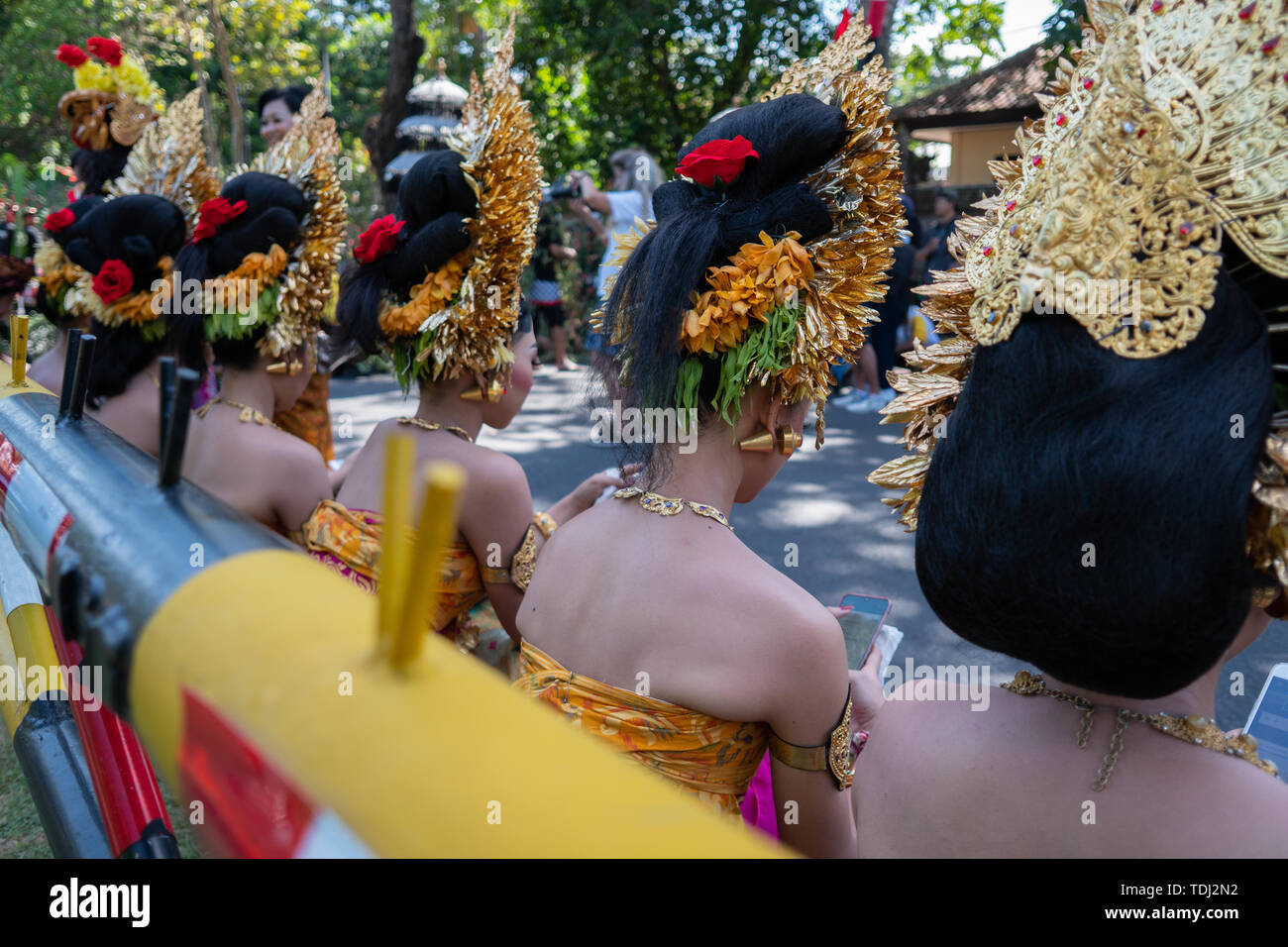 Young Balinese women wearing traditional Balinese headdress and traditional sarong at the opening ceremony of the Bali Art Festival 2019. Stock Photo
