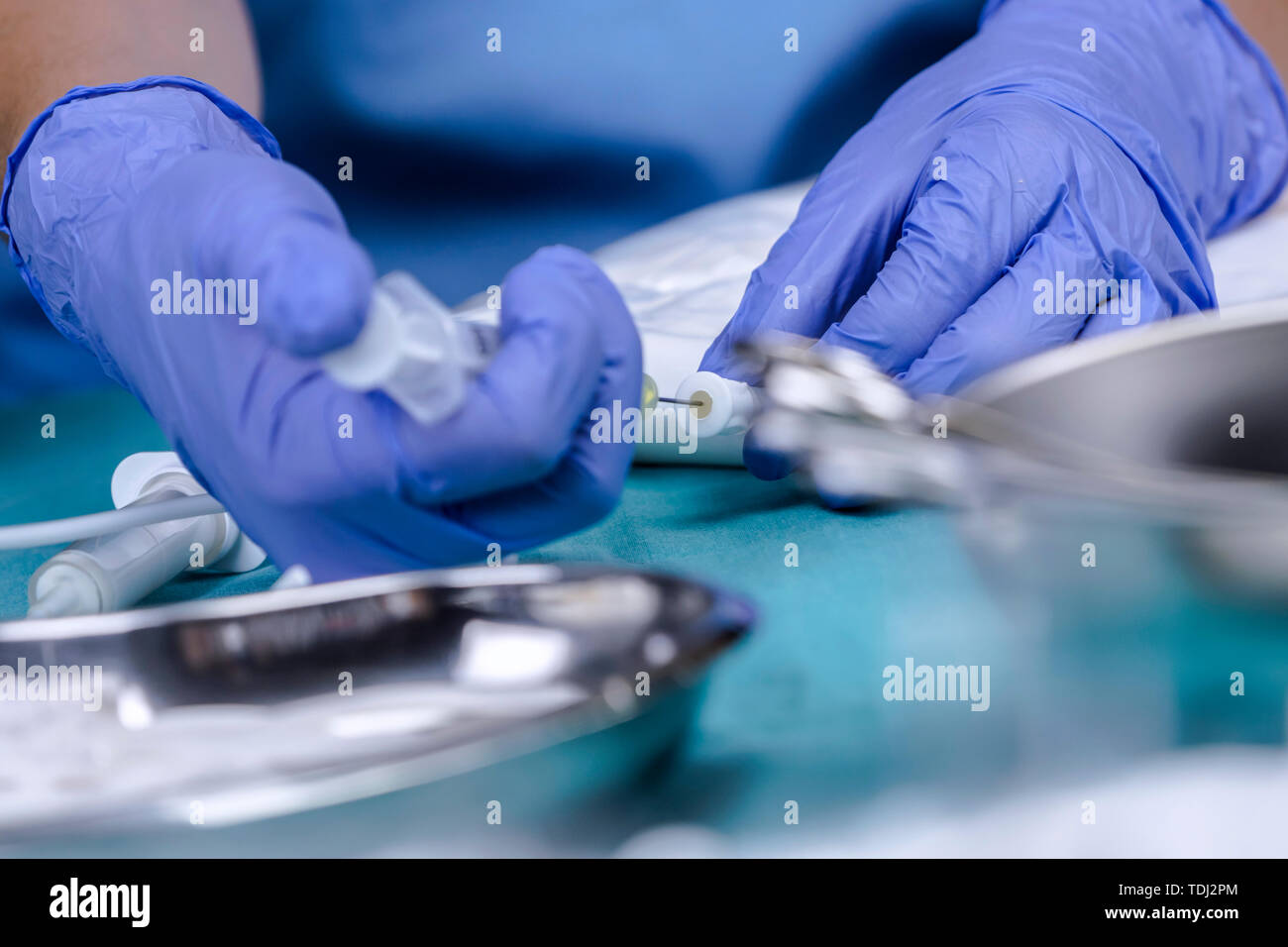 Nurse preparing medication for parenteral nutrition in a hospital, conceptual image Stock Photo