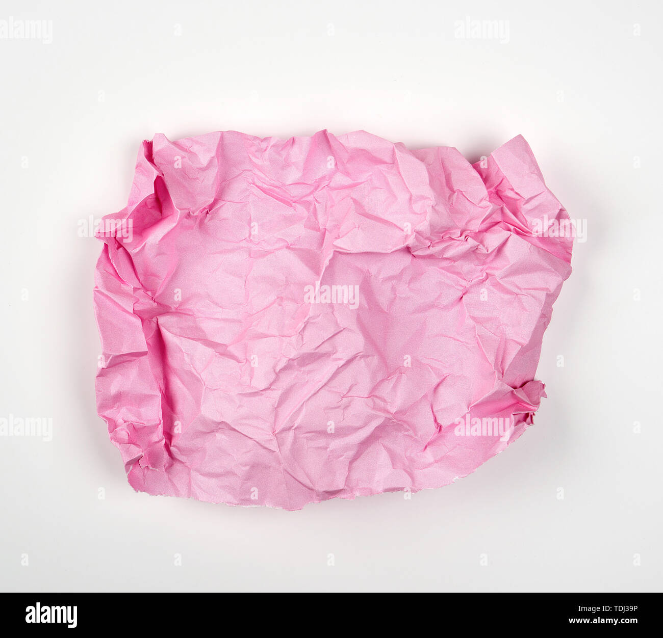 crumpled pink rectangular sheet of paper on a white background, copy ...