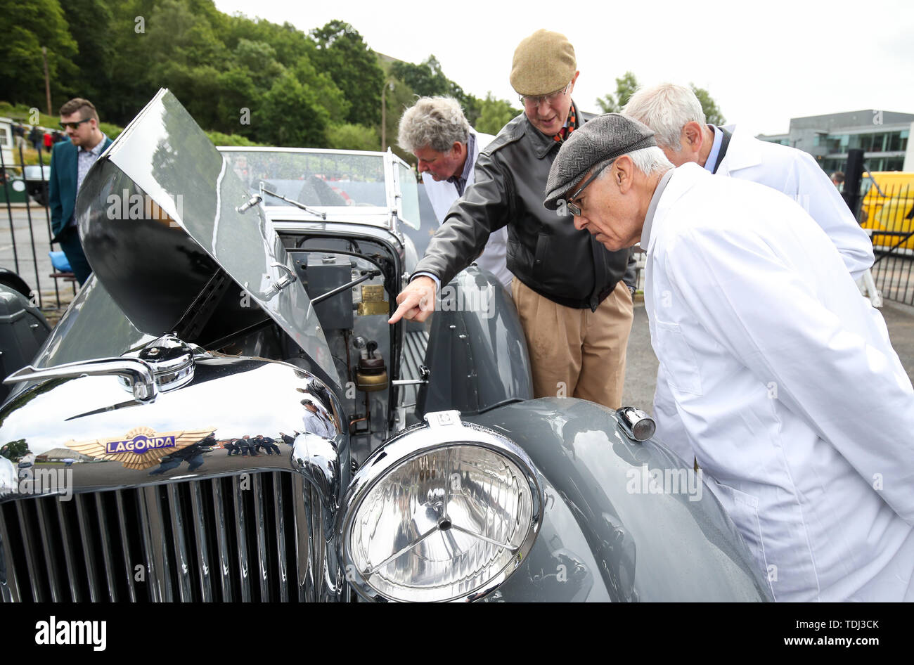 Judges from the VSCC (Vintage sports Car Club) inspect a 1937 Lagonda LG 45, for the traditional concours d'elegance, during the Brooklands Double Twelve Motorsport Festival at Brooklands Museum, in Weybridge, Surrey. Stock Photo