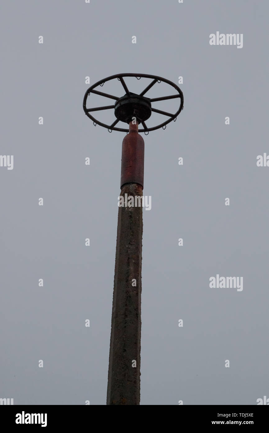 old and non working weather vane against the evening sky Stock Photo