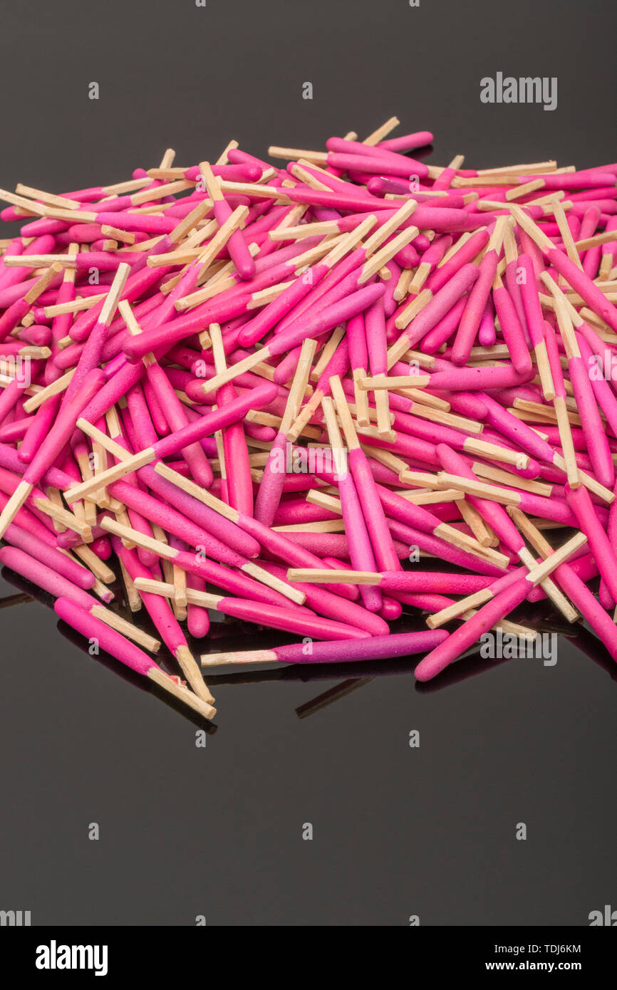 Random pile waterproof stormproof emergency matches. Metaphor survival skills, chaotic mind, disorganized, random, lost in crowd, let the chips fall. Stock Photo