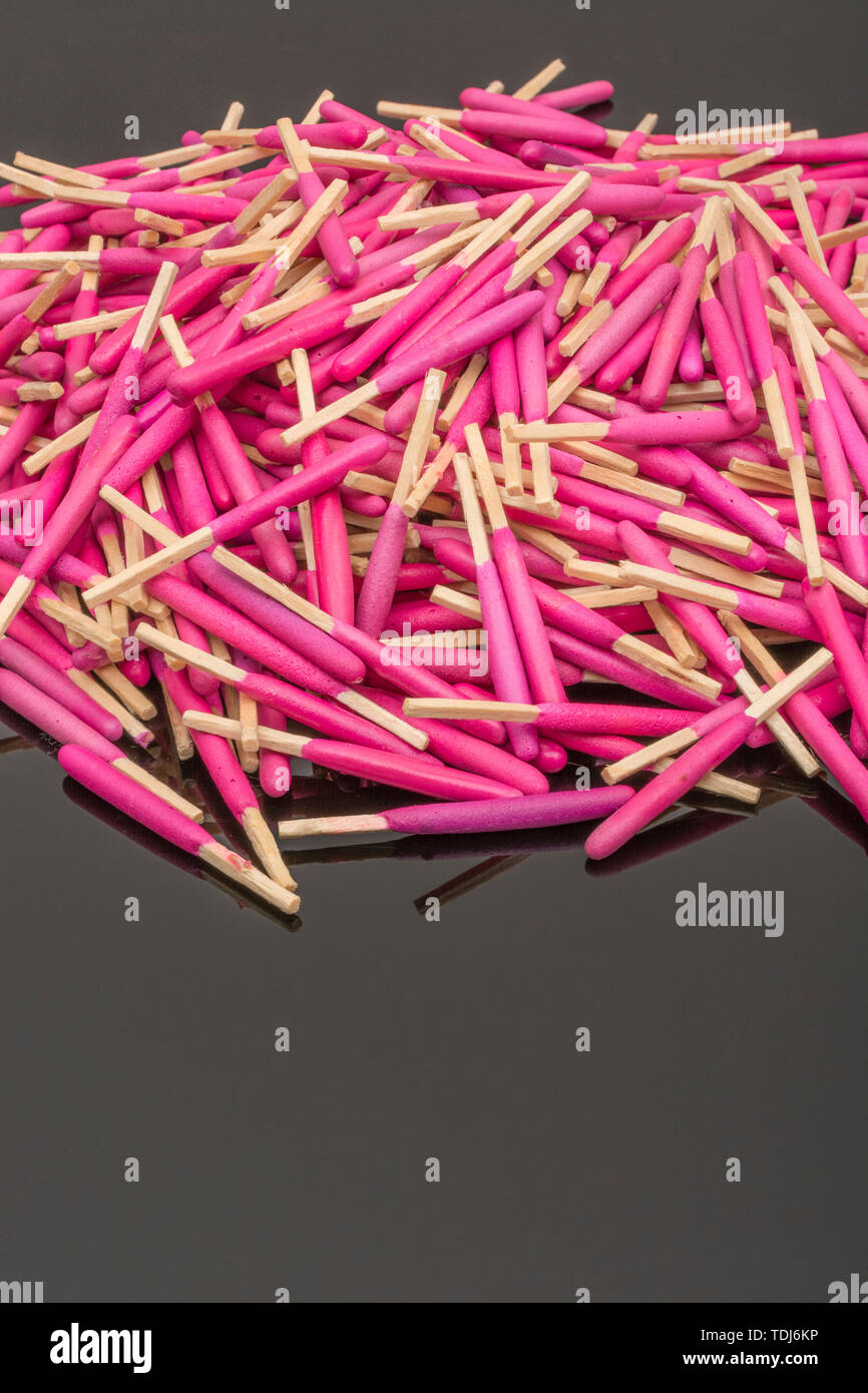 Random pile waterproof stormproof emergency matches. Metaphor survival skills, chaotic mind, disorganized, random, lost in crowd, let the chips fall. Stock Photo