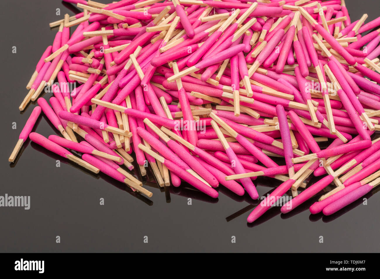 Random pile waterproof stormproof emergency matches. Metaphor survival skills, chaotic mind, disorganized, random, lost in crowd, let the chips fall. Stock Photo