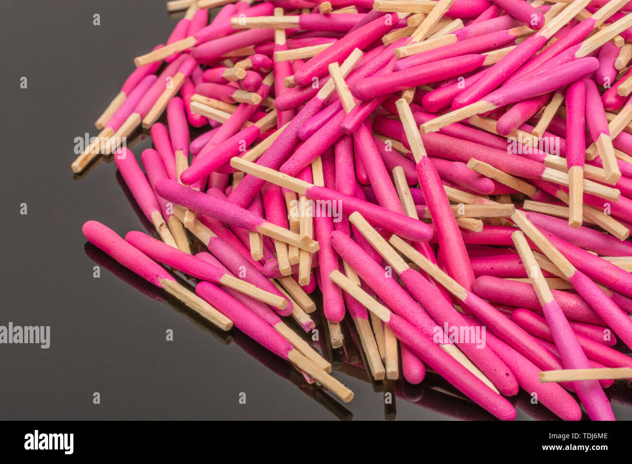 Random pile waterproof stormproof emergency matches. Metaphor survival skills, chaotic mind, disorganized, random, lost in crowd, let the chips fall. Stock Photo