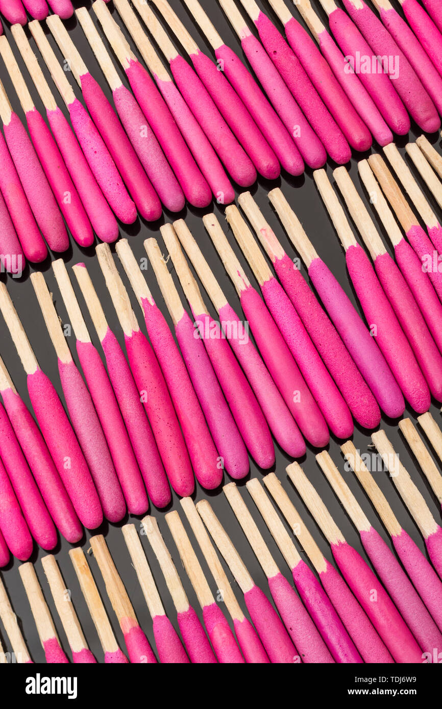 Neat rows of waterproof stormproof emergency matches. Metaphor survival skills, organized mind, neat and tidy mind, regimented, lined up, in neat line Stock Photo