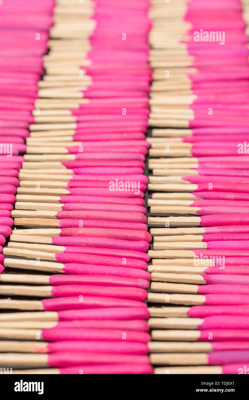 Neat rows of waterproof stormproof emergency matches. Metaphor survival skills, organized mind, neat and tidy mind, regimented, lined up, in neat line Stock Photo