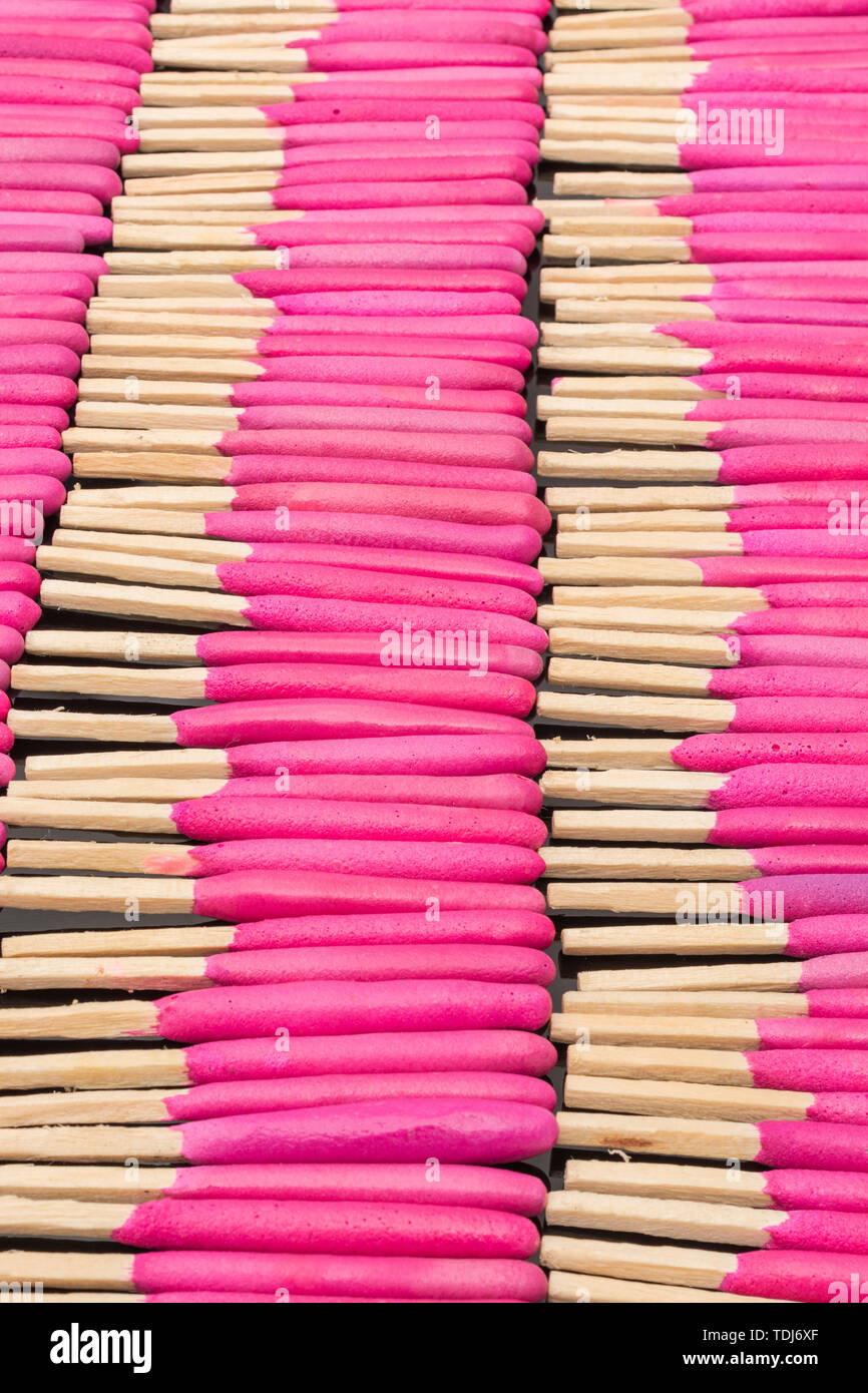 Neat rows of waterproof stormproof emergency matches. Metaphor survival skills, organized mind, neat and tidy mind, regimented, lined up, in neat line Stock Photo