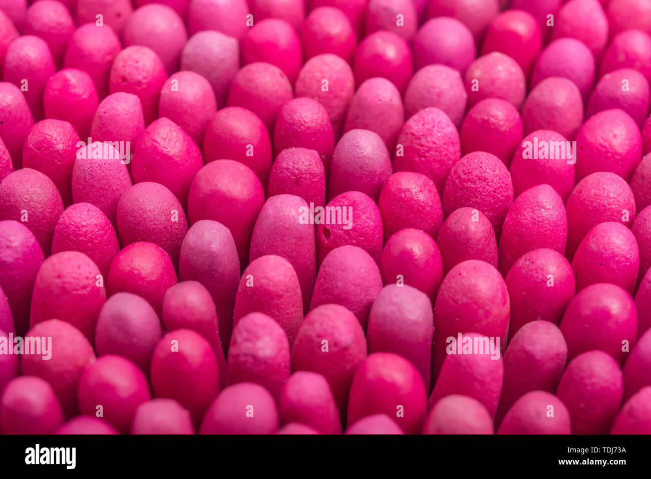 Macro close-up of massed waterproof stormproof emergency matches tightly packed. Metaphor survival skills, crammed, tight squeeze, jostling for space. Stock Photo