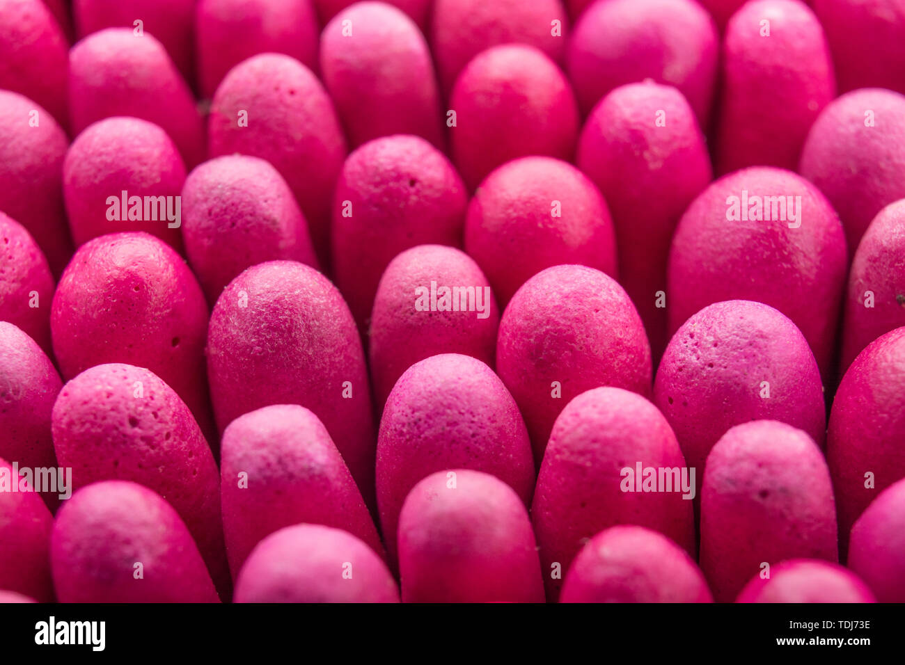 Macro close-up of massed waterproof stormproof emergency matches tightly packed. Metaphor survival skills, crammed, tight squeeze, jostling for space. Stock Photo