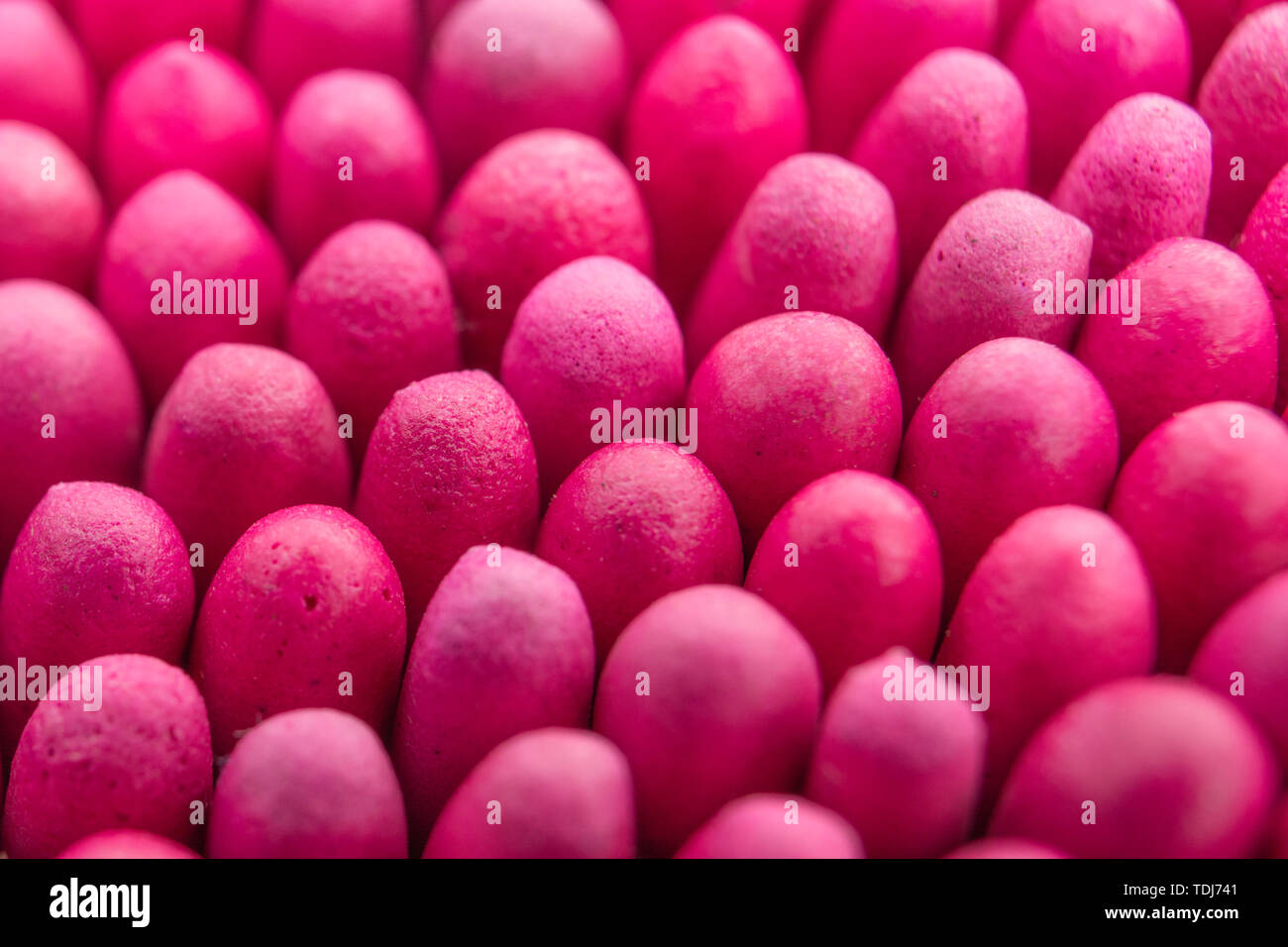 Macro close-up of massed waterproof stormproof emergency matches tightly packed. Metaphor survival skills, crammed, tight squeeze, jostling for space. Stock Photo