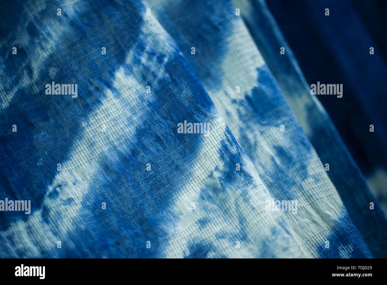 Batik braid glowing dots abstract background Stock Photo
