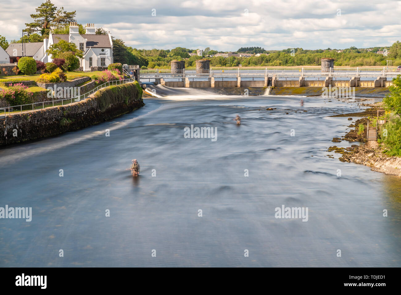 Fisherman in Corrib river dam, Galway, Ireland Stock Photo - Alamy