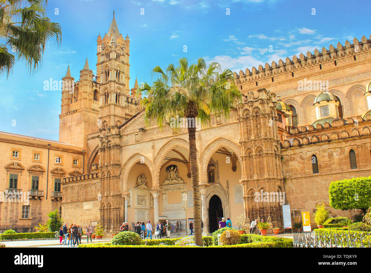 Palermo, Sicily, Italy - Apr 11th 2019: Palermo Cathedral with tourists in front. Roman Catholic church, Cathedral of the Assumption of Virgin Mary. Famous local landmark. Stock Photo