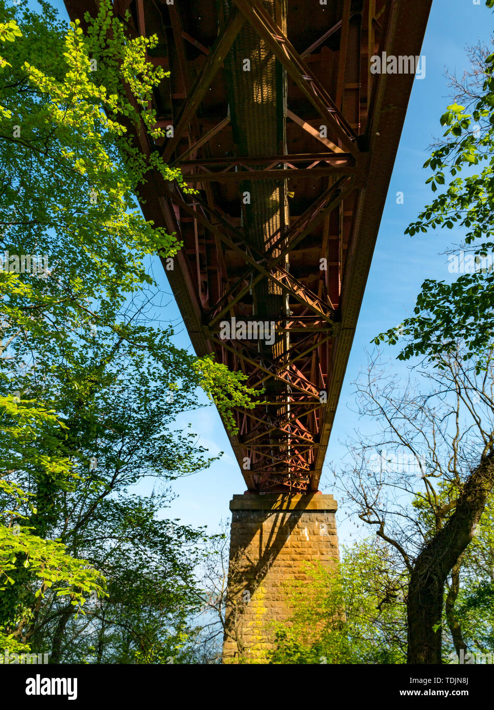 View from underneath Victorian cantilever Forth Railway Bridge on sunny day, Scotland, UK Stock Photo