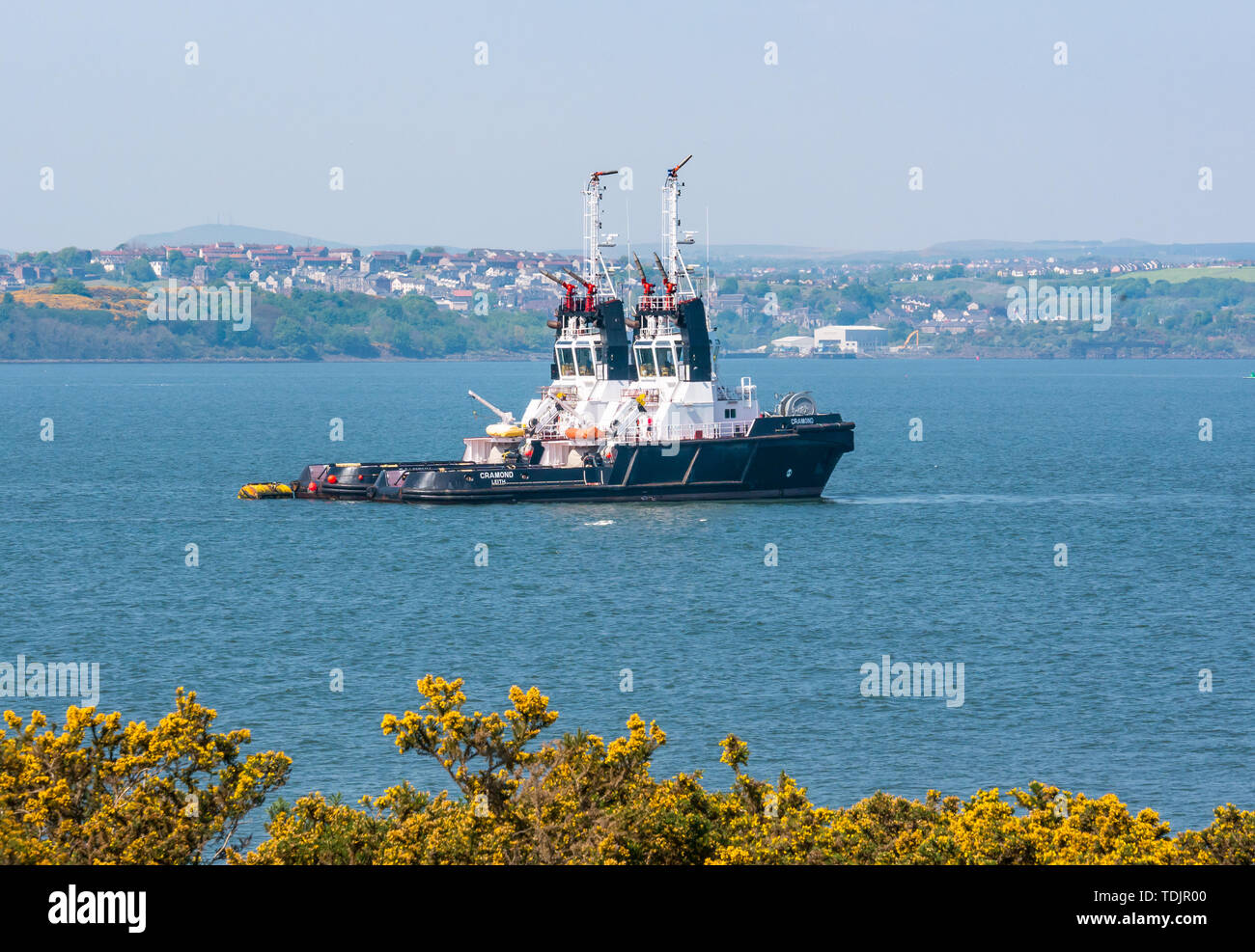 Pair of tugboats moored near Hound Point, Firth of Forth,  Scotland, UK Stock Photo
