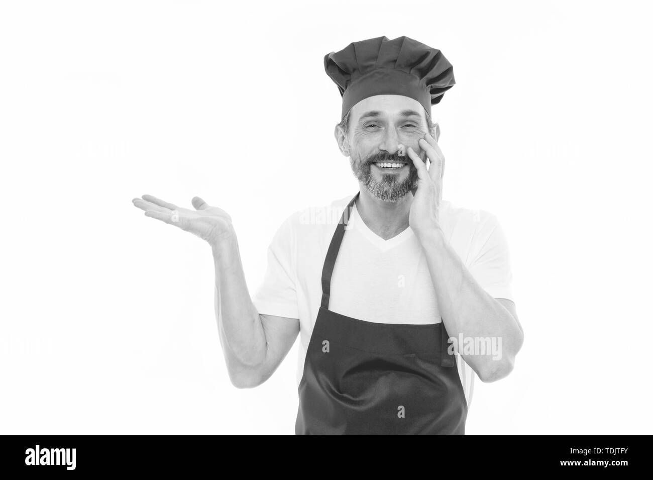 Presenting Product Bearded Mature Man In Chef Hat And Apron Pointing Hand Aside Senior Cook 