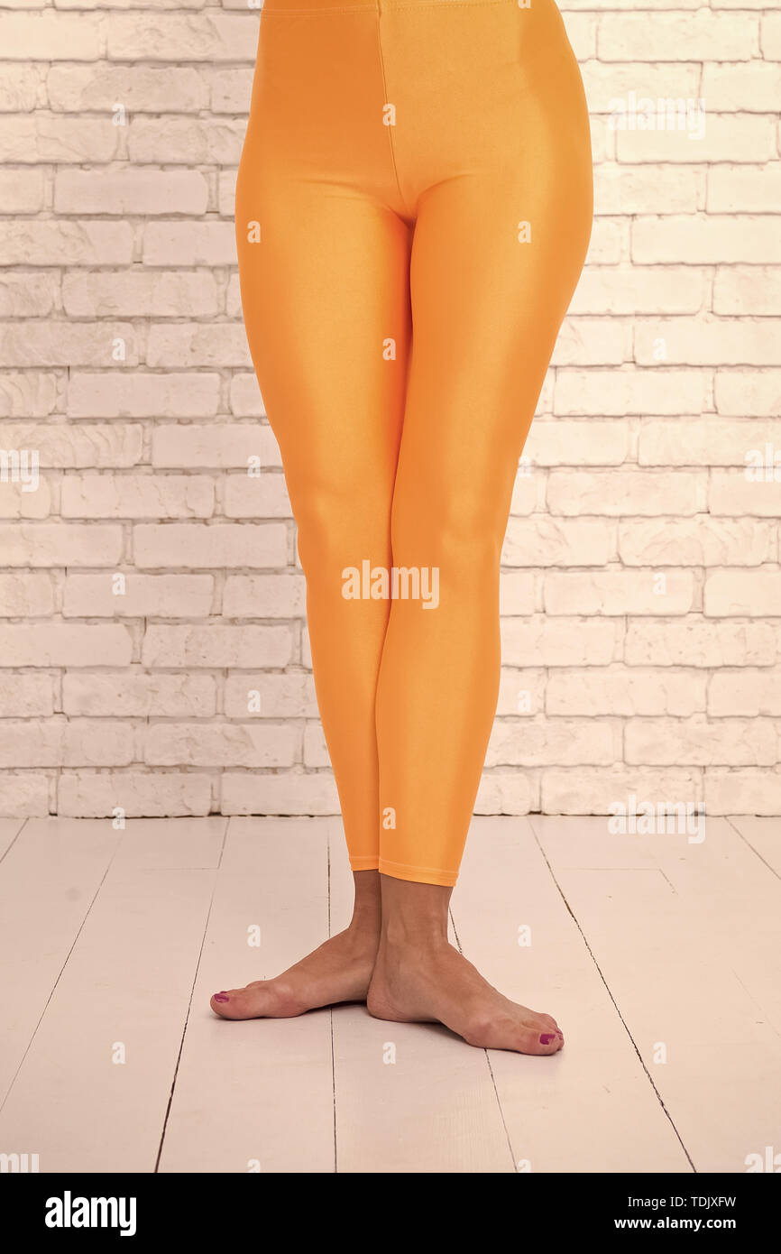 Orange leggings hi-res stock photography and images - Alamy