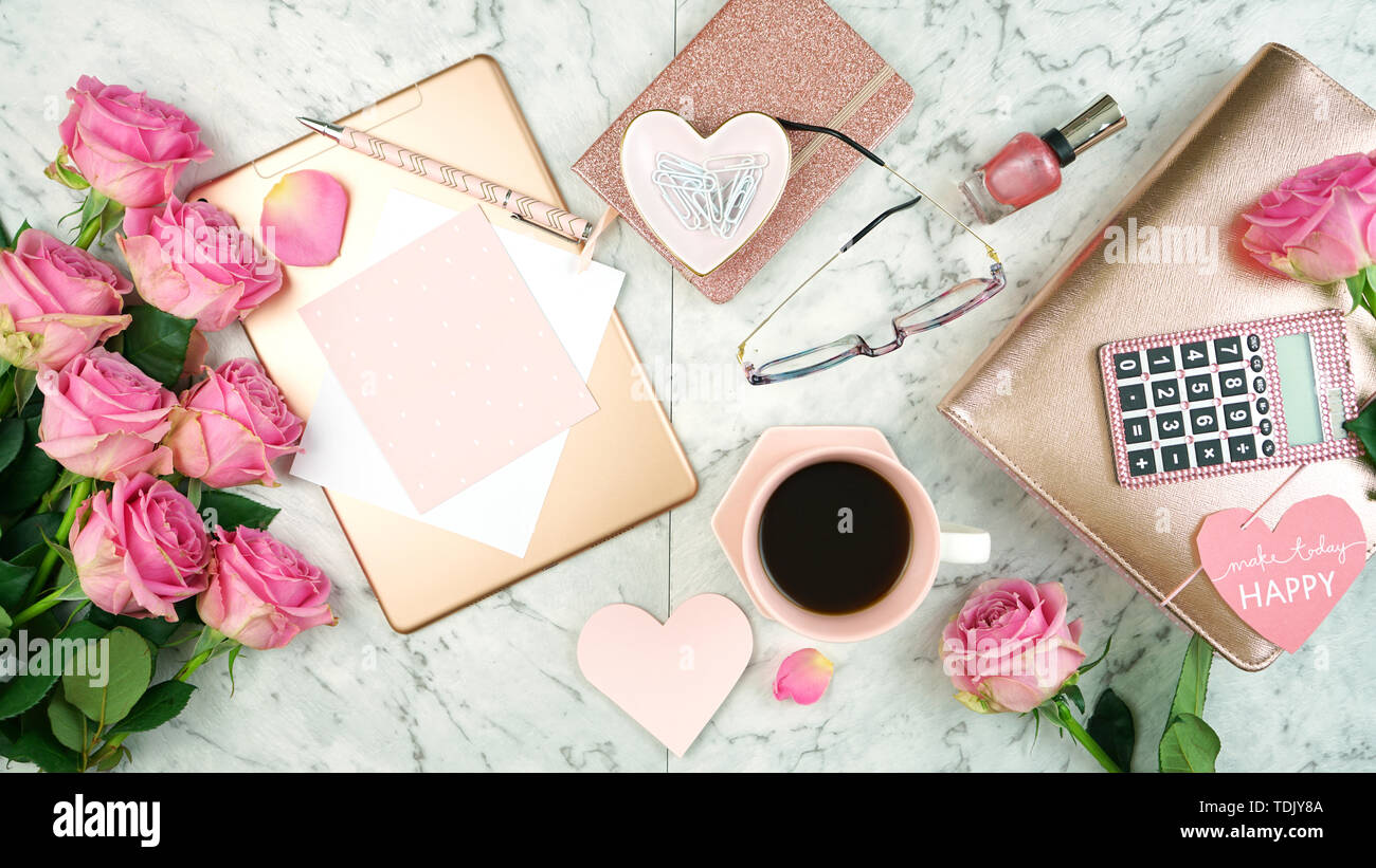 Ultra feminine pink desk workspace with rose gold accessories on white  marble background flatlay overhead Stock Photo - Alamy
