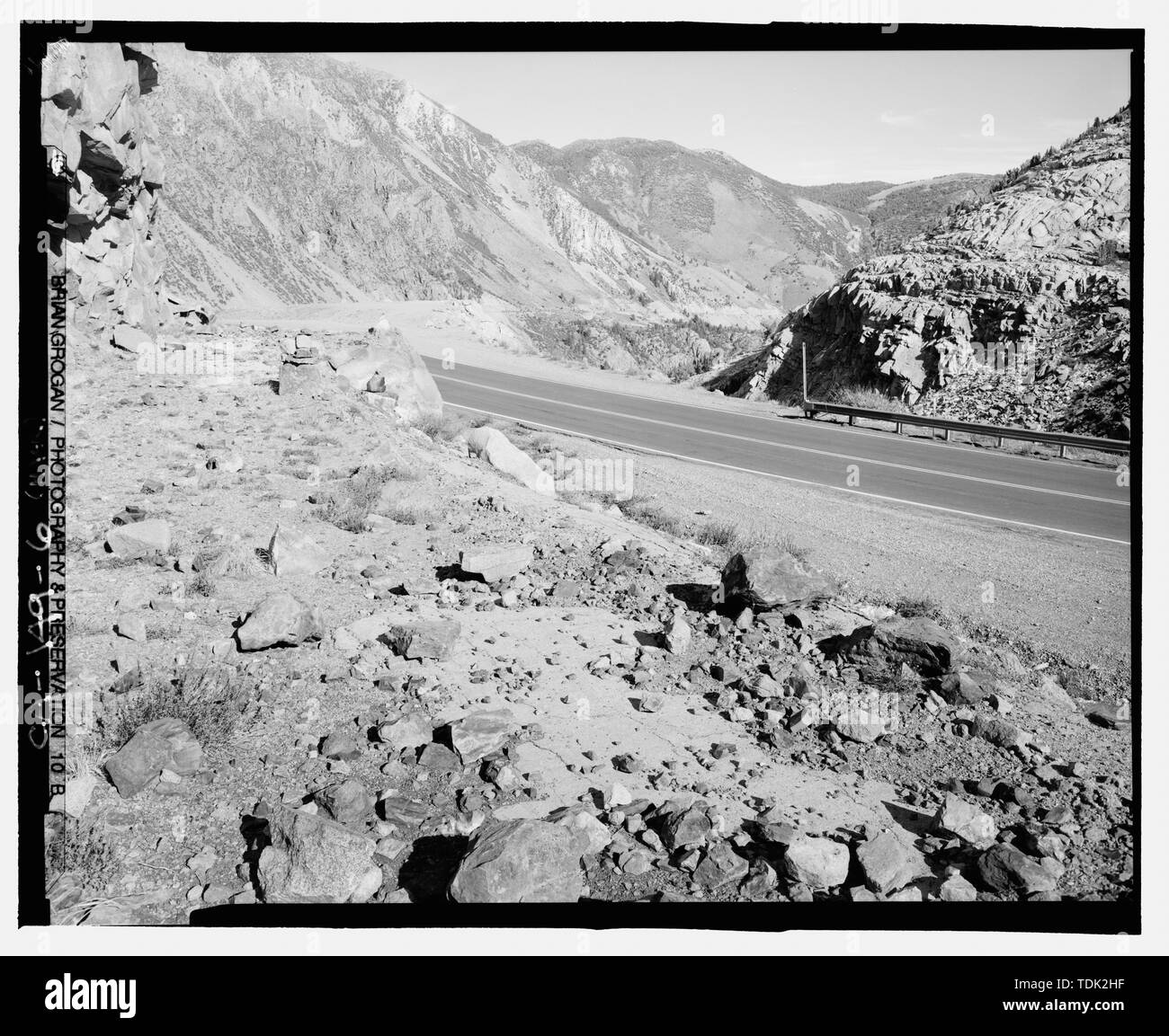 OLD AND NEW TIOGA ROAD. NOTE REMNANTS OF OLD ROAD ON LEFT. NOTE ROAD CUT ON CANYON WALL IN CENTER REAR. LOOKING NNE. GIS- N-37 56 19.5 - W-119 13 53.3 - Tioga Road, Between Crane Flat and Tioga Pass, Yosemite Village, Mariposa County, CA Stock Photo
