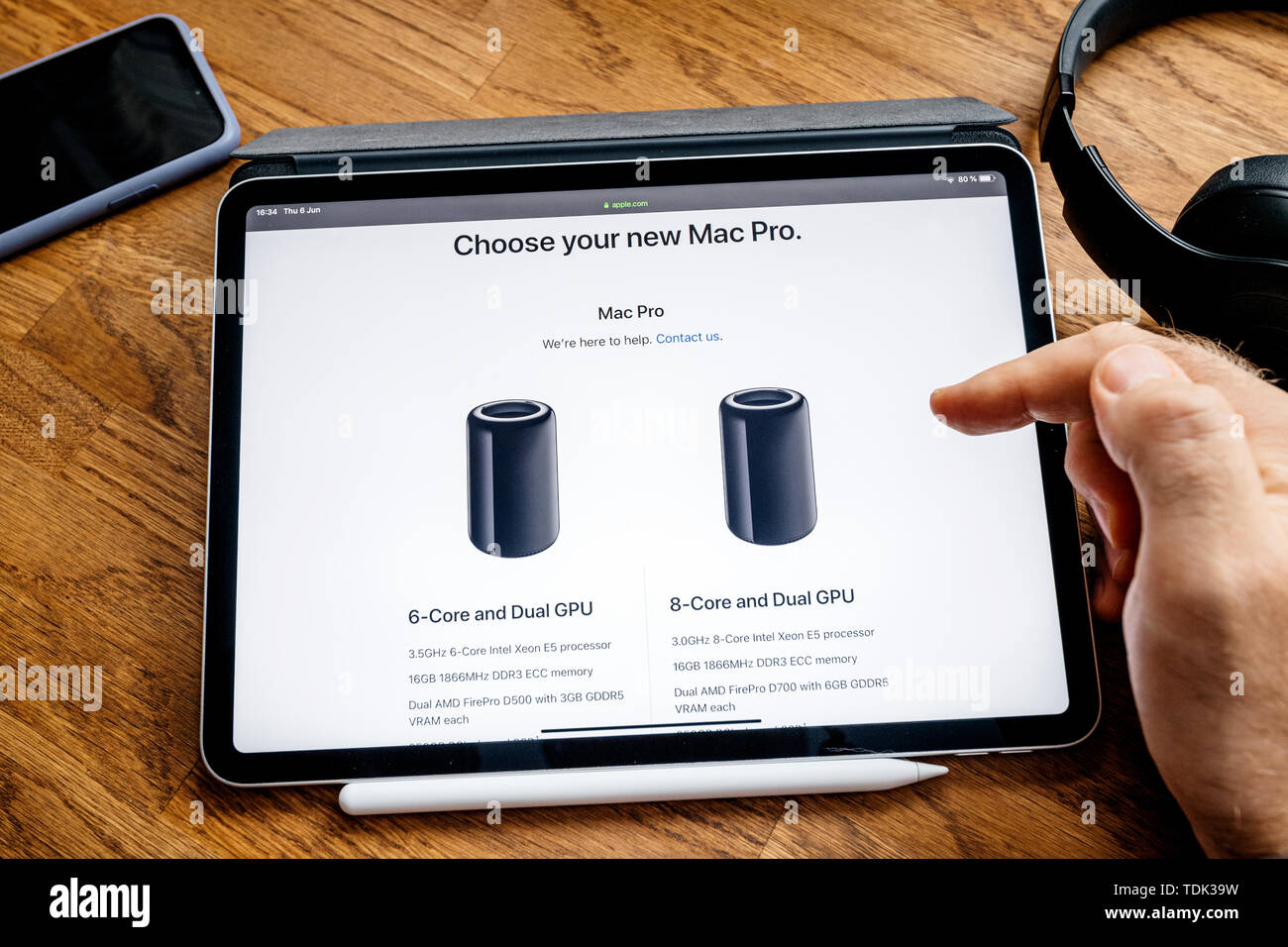 Paris, France Jun 6, 2019 Man reading on Apple iPad Pro tablet about