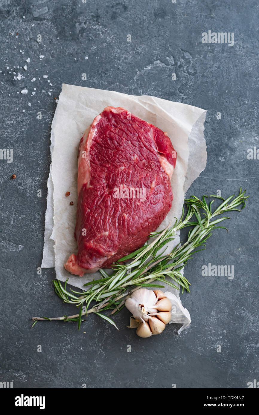 Raw black angus prime beef steak variety with rosemary, sea salt and spices Stock Photo